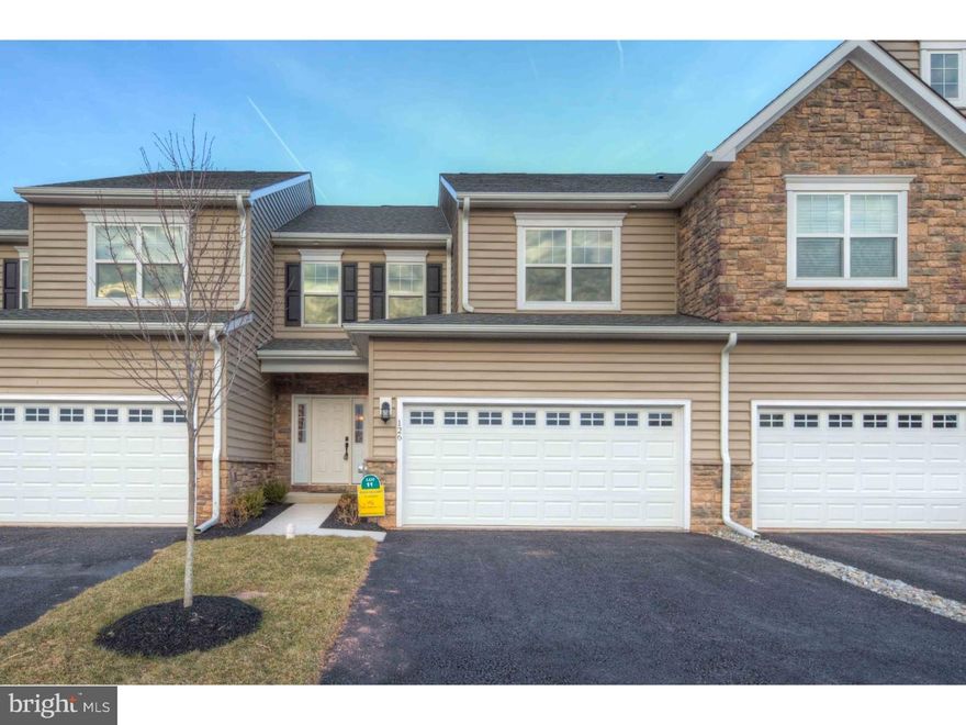 NEW CONSTRUCTION is MOVE-IN READY! One of several! Lifestyle, Location, and Luxurious features combine to complete this All Inclusive Carriage Home in the new Enclave at Ridgewood, brought to life by Rouse Chamberlin Homes. Boasting Famously Large Bedrooms, Breath-taking Closet Space, and Heart Warming Open Concept Design, the 28 ft. wide Essex is being called the Perfect Floorplan whether as first, or "forever" home.  Step into the wide welcoming Foyer and follow the inviting sight line past an open formal Dining Room with hardwood, crown molding, and chair rail. Live from the heart of the Elegant Ridgewood Kitchen adjoining the Expanded Great Room where loved ones will gather and share. The oversized Kitchen Island is topped with captivating Quartz. The Kitchen boasts distinctive 42" Cabinetry in White with soft close doors and drawers, set against a beautiful ceramic tile backsplash.  Kitchen time is an everyday pleasure with a farm size undermount stainless steel sink and GE stainless steel gas range, microwave, and dishwasher. The Breakfast area is bathed in soft natural light from the Slider leading to the rear composite Deck with steps to the lawn.  A showpiece Oak Staircase with Arts n Craft Railing turns elegantly to the second floor. The Owner's Suite impresses with double doors off the private hall area, and the Essex's enormous Walk-in Closet gets a "WOW" every time. You'll be treated to a Deluxe Shower package in the Master Bath with 12x12 tile and shower seat, plus tile base, comfort height vanities and commode. Don't miss the two remarkably large additional bedrooms with wonderful closets.  A second floor Laundry Room with Utility Closet offers multi-purpose convenience. Upgrades run from top to bottom with a 9ft foundation in the Full Basement and rough-in plumbing for a full bath in any future finishing. There's upgraded recessed lighting throughout, upgraded light fixtures, upgraded carpet and flooring. Take back your weekends and set yourself up with an easy come and go lifestyle where grounds keeping and snow removal are provided. The community borders 88 acres of picturesque open space, future parks, and walking trails, yet is located a quiet 1.8 miles from Route 422 at Royersford, only minutes from every shopping need. For enriching "clubhouse" programs, try a 2 minute drive to the Spring Valley Y and enjoy an invigorating swim any day of the year! Visit the community Sales Office 11am-5pm Thursday through Monday. Stop in today
