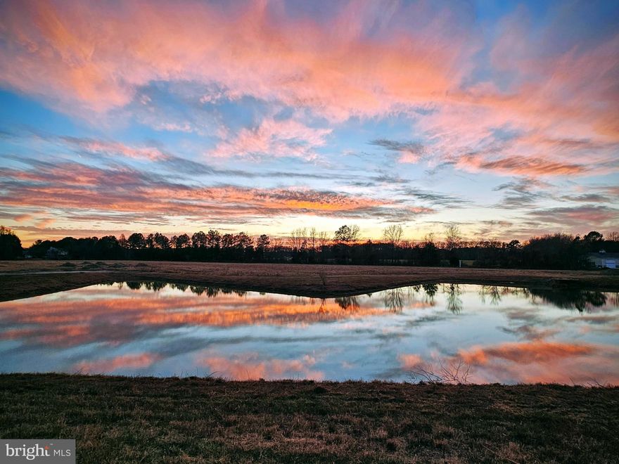 Lot 2 Sunset Refuge. 0.68 Acres, Incredible pond views- Delmar's newest and most incredible housing subdivision!  9 estate sized lots on 30 Acres! Want acreage and a picturesque country setting but want to be close to everything, be in the Delmar School District, AND pretty close to the Beach? Want to see sunsets you never imagined were here in Delmar? Hard to believe, but you found it!! Delmar's best large homesites ever available! Never offered before and nothing like it has been available in Delmar ever! These estate sized home lots range from 0.68-6.32 Acres and are served by public water & sewer, so no hassles of septics and wells. The site is a total of 30 Acres of Natural Beauty, surrounded by trees. While many country lots may sit near poultry houses and undesirable visuals, Sunset Refuge is exactly the opposite! It's a getaway from everything, a slice of serenity, like living on a nature preserve. Absolutely beautiful natural setting with a variety of ponds, elevated berms creating scenic vistas, wooded seclusion, natural grasses, open spaces, and best of all there are phenomenal Sunsets here nightly! Plus it's walking distance to the new Oaked 54 Whiskey & Wine Bar Restaurant that just opened! This very unique opportunity truly provides the best of two worlds. You get stunning country style lots with privacy, plenty of space, and NO HOA, but you are nestled behind the Heron Ponds community, so there will be plenty of friends and neighbors close by for get-togethers. Access to the community is through Heron ponds so you also enjoy the benefits of sidewalks, streetlights and great places to walk and ride bikes nearby on the streets of Heron Ponds.  Yes, you read that right...NO HOA! This is a separate subdivision, which was previously approved for 90 homesites, but will be offered now as 9 premium estates. LOCATION, LOCATION, LOCATION!! This is prime time close to everything AND is in the AWARD WINNING DELMAR SCHOOL DISTRICT! Enjoy the freedoms that come with a rural setting, but the connections of friends and convenience at your fingertips!  (**Lot 1: SOLD!!! 5.53 Acres, $229,900, mostly flat open space with frontage on a large pond and access off Royal Tern. ) (**Lot 2: price currently available, access off Heron Ponds Pkwy circle. ) (**Lot 3: 6.32 Acres, $244,900 the largest lot with the largest privately owned pond plus frontage on a 2nd large pond, access off Heron Ponds Pkwy circle.) (**Lot 4: 4.04 Acres $219,900, private pond, partly wooded, cleared pad site already there, views to larger pond on lot 3, water/sewer has already been run back to clearing, access off Heron Ponds Pkwy circle.) (**Lot 5: 1.88 Acres, $129,900, partly wooded, partly clear, access off Bobwhite Dr.) (**Lot 6: 2.58 Acres, $149,900, partly wooded / partly clear, access of Mourning Dove Way) (**Lot 7: 1.2 Acres, $119,900, mostly wooded, access off Mourning Dove Way) (**Lot 8: 5.23 Acres, $229,900, large private pond, mostly wooded with clearings around the pond, access off Song Sparrow Cir.) (**Lot 9: 2.63 Acres, $149,900, wooded, access off Song Sparrow Cir.)  HOME / LOT PACKAGES MAY ALSO BE MADE AVAILABLE SOON!  SO STAY TUNED OR REACH OUT TODAY! Agent related to seller. Seller is a licensed Agent. Impact/tie in fees to the town of Delmar are currently $11,000. There are only a handful of these lots available, so don't hesitate and let someone else live your dream!  Photos show all lots, see labels. Lots 2 and 3 Sold together.