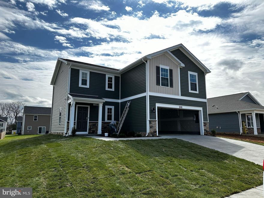 Immediate Delivery! The Deerfield is a thoughtfully designed two-story house with four bedrooms and 2.5 baths. The kitchen, with espresso cabinets, granite countertops, and stainless-steel appliances features a huge walk-in pantry and island. That island includes a single bowl, undermount sink and has plenty of room for stools - making it perfect for food preparation while you entertain. The kitchen looks out over the open-concept dining area and great room. All four bedroom are upstairs along with the laundry room. The Primary Suite includes an en-suite bathroom with a large, tiled shower and double vanities, as well as a very spacious walk-in closet. The hall bath has double sinks as well – no fighting over counter space in this home! Quality materials and workmanship throughout, with superior attention to detail, plus a one-year builders’ warranty. Your new home also includes our smart home technology package!