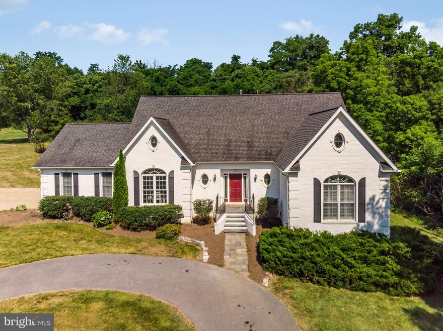 A rare gem in a beautifully landscaped oasis of over 4 acres overlooking a pristine creek.   Why build a new home when this home has been fully painted walls and ceilings, new carpet throughout,  just upgraded the master shower.    Just like a gem, it sparkles with "new".  Have wine and cheese in the Gazebo near the water or a barbecue on the freshly painted deck in the back.  The entire home has just been painted including the ceilings and new carpet installed throughout.   Main level master suite with a steam  shower and spacious walk-in closets.  Have coffee in the morning on the balcony off of the master bedroom with an amazing water view.   The house is spacious with 4 large bedrooms and an open/large great room with a fireplace.   Two HVAC Zones for your absolute comfort in both winter and summer.   Well built house with brick on all four sides and long driveway for complete privacy. Minutes away from shopping and major transportation routes.  Truly a must see!