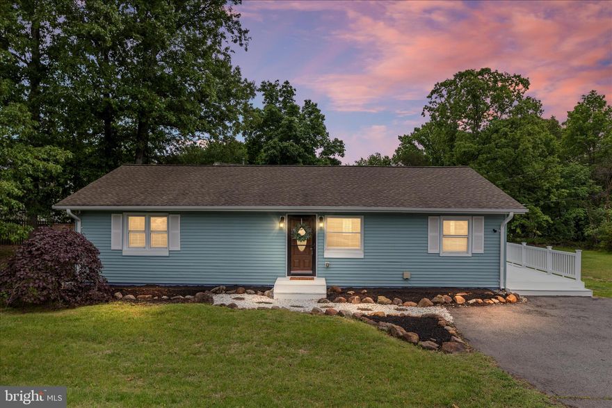 Located on a private 1-acre lot with no HOA, this updated and well-maintained ranch/rambler offers peaceful living in the heart of Gainesville. This charming one-level home features 3 cozy bedrooms and 2 full baths, along with numerous updates throughout. The partially wooded lot offers a great balance of privacy, natural beauty, and sunny space for gardening or outdoor enjoyment. Connected to public water and sewer, the property also includes an asphalt driveway with room for multiple vehicles. Brand new luxury vinyl and carpet have been installed. Recent improvements within the last 5 years include thermal windows, HVAC system, and a roof with an 8kW grid-connected solar array to help keep utility costs low. The kitchen features updated appliances, while the guest bath combines vintage charm with modern finishes including a cast-iron tub, subway tile accents, and quartz vanity.  Easy access to Routes 29, 28, I-66, and the Broad Run VRE station.  Rarely can you find acreage, privacy, and no HOA restrictions this close to major commuter routes, shopping, restaurants, top rated schools and entertainment.
