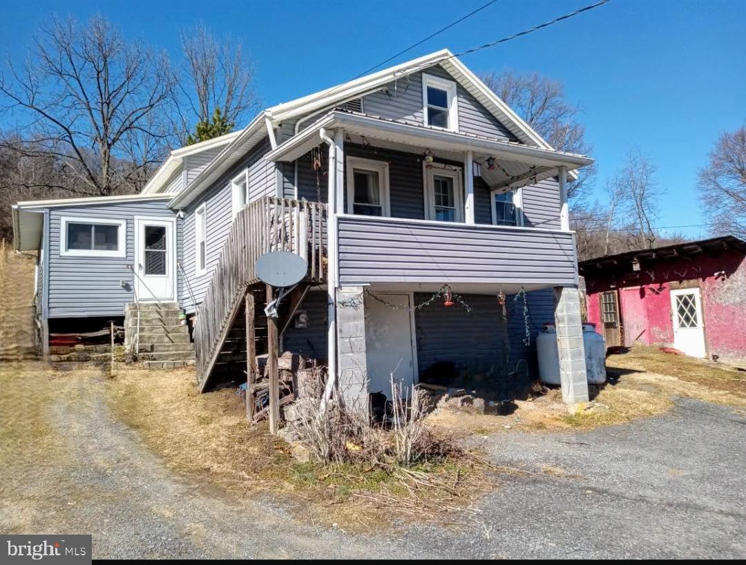 2 homes for one price, this property features two entirely separate houses, both use the same well and on public sewer. Fix these up just how you would like them and enjoy the views of the mountainside. Lots of space and privacy.