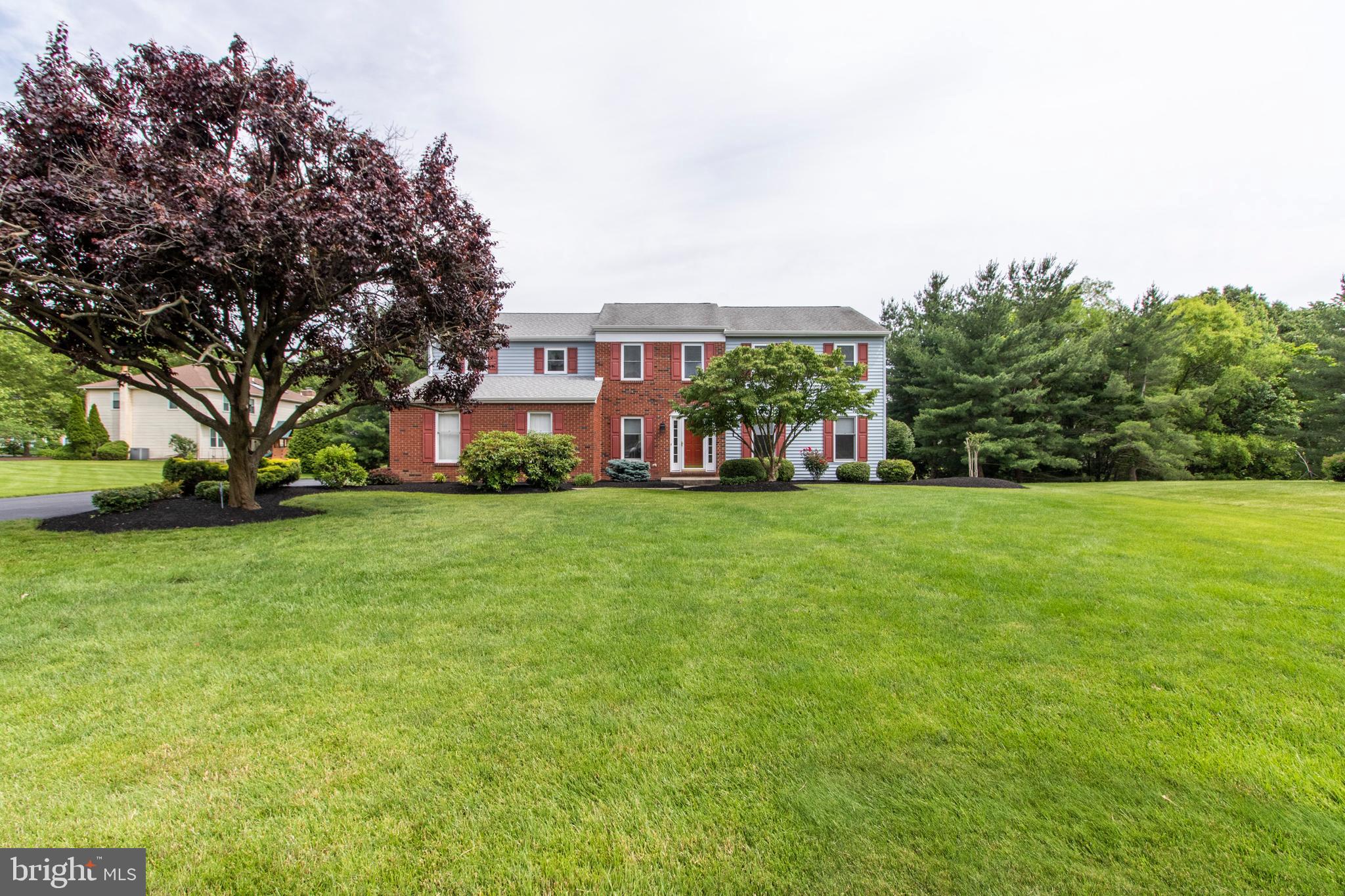 Open For Admiration!!!Take a close look at this move in ready, center hall colonial located in a prime location in the Mews at Blue Bell! From the well-manicured landscaping to the meticulously cared for interior, this home is a must see.Enter through a new front door into the foyer featuring new hardwood floors and wainscoting panels which continue into the elegant living room and dining room. The kitchen is warm and welcoming with maple wood raised panel cabinets, granite countertops, a roomy eating area, a large pantry and ceramic tile flooring. The cozy family room is only a few steps from the kitchen and highlights a raised hearth, brick wood burning fireplace, exposed beams and ceiling fan with easy access to the backyard patio. Rounding out the first floor is a powder room and laundry with side door access to the outside and two car attached garage.Upstairs, the master bedroom provides privacy and comfort with a walk in closet, ceiling fan and new carpet along with an ensuite bathroom including a soaking tub, shower, double vanity, tile floor and skylight. The other second floor bedrooms (4) are newly carpeted with generous closet space. The hall bath contains a double sink, shower/tub, tile floor and skylight.You will delight in the finished basement with light colored paneling and carpet ready for your hobby room, gym, workshop or an office. With 2 sump pumps and battery backup, water penetration will not be an issue.As an extra bonus, this home is in the award winning Wissahickon School District, close to great shopping and major highways. Don t delay ..schedule your showing today!