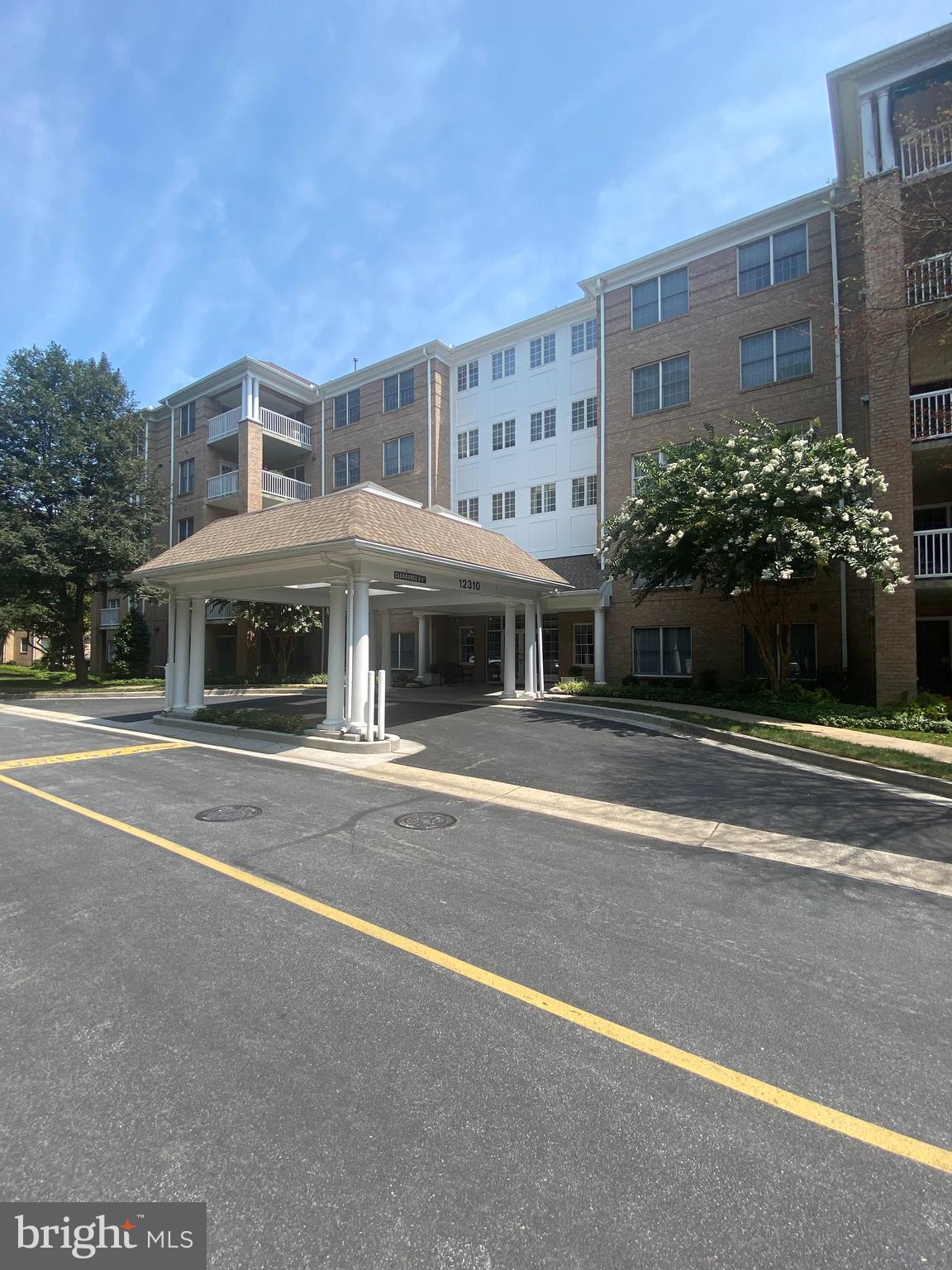 Meticulously maintained condominium with crown moulding, hardwood floors, gas fireplace, cherry cabinetry, breakfast nook and balcony overlooking walking trail and wooded area. Elevator and underground, secure, assigned parking with additional parking for guests. Custom window treatments and blinds. Separate locked storage area on same floor by floor elevator. Community trash chute for easy disposal of trash. Secure, coded entrance to building. Newly decorated and furnished entrance lobby with separate mail room. Quiet street. Walking distance to community shopping center including Graul's, restaurants, and banking. Walking distance to public pool with basketball court (membership required).