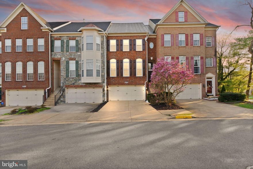 Welcome home to this stunning, light-filled, and rarely available freshly painted, move-in ready brick townhome featuring a two-car garage and a prime location near I-395 and I-495. Enjoy the convenience of walking to nearby restaurants and close proximity to The St. James.

Warm hardwood floors greet you as you enter this expansive 5-bedroom, 4.5-bath residence. The elegant living room is bathed in natural light, showcasing dramatic floor-to-ceiling Palladian windows and soaring ceilings. The dining room, adorned with classic wainscoting, offers the perfect setting for memorable gatherings. A gas fireplace beautifully anchors the space, seamlessly connecting the living room, dining room, family room, and kitchen.

The newly renovated kitchen is a true centerpiece, featuring a gas cooktop on a center island, white cabinetry, quartz countertops, and space for a breakfast table. The adjoining family room is bright and inviting, complete with a built-in bookcase and direct access to a Trex deck—perfect for entertaining and enjoying outdoor living.

Upstairs, the third level offers three bedrooms and two full baths, including a spacious primary suite with a walk-in closet and a spa-inspired bath featuring a soaking tub, double vanity, and separate shower. The fourth-level loft provides a sunlit and versatile retreat overlooking trees and common areas, complete with a second primary bedroom and full bath—ideal for guests, a private office, or an additional living space.

The fully finished lower level offers incredible flexibility with a recreation room, full bath, additional bedroom, and laundry room, along with walk-out access to a private patio and fenced yard—perfect for relaxing, grilling, or creating your own outdoor oasis. This level also provides direct access to the garage.