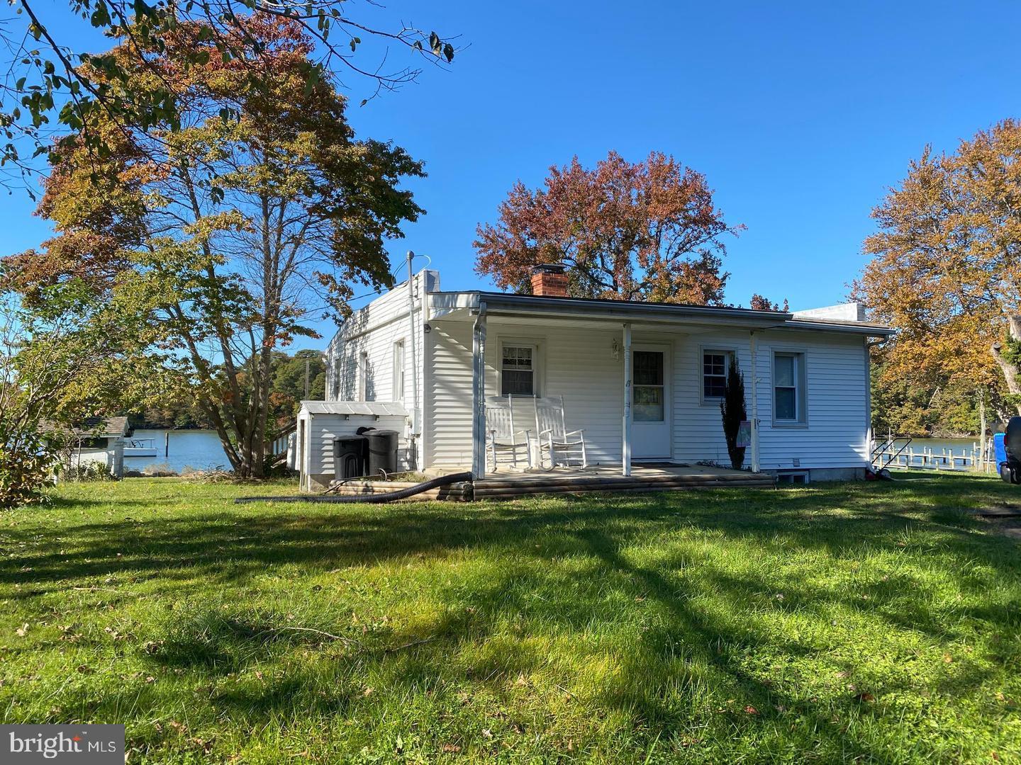 Waterfront Cottage on Cox Creek features 2 bedrooms, 2 baths, galley kitchen, spacious family room leading to back deck overlooking beautiful views and finished basement. Won't last long