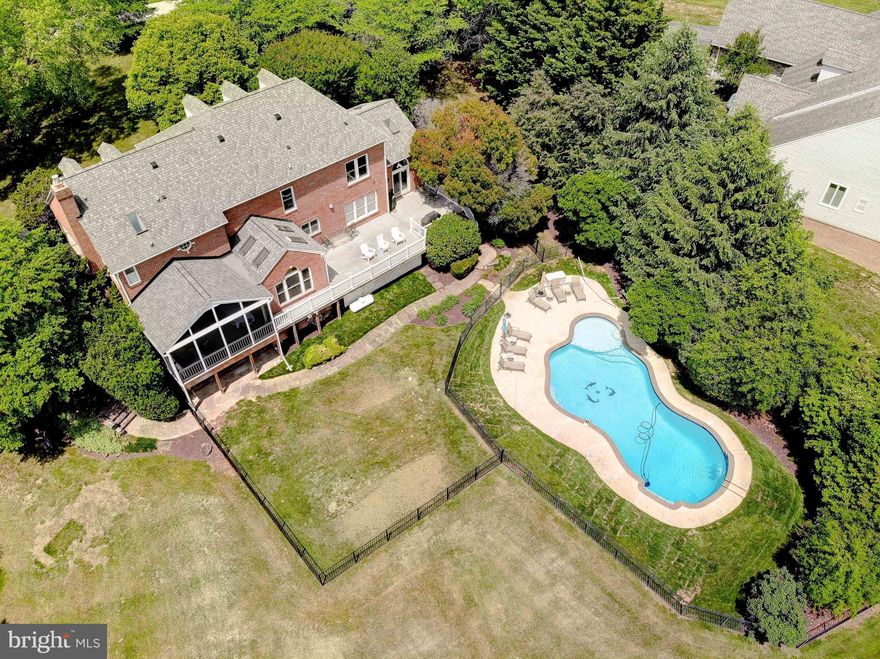 * Make sure to view the 3D Walkthrough! * Nestled on just over two perfectly flat and fully usable acres, this beautifully maintained colonial offers a rare blend of space, comfort, and thoughtful upgrades in one of Davidsonville’s most desirable neighborhoods.
The vinyl-fenced backyard is a true outdoor oasis. You'll find a separate fenced area perfect for pets, an additional iron-fenced enclosure surrounding the in-ground pool, and a double gate providing easy vehicle access to the backyard. Mature trees around the property enhance the sense of privacy and tranquility.
Step inside to discover a spacious and well-designed layout ideal for both daily living and entertaining. Off the foyer, you’ll find formal living room with a a sun-filled sunroom on one side, and a bright, window-lined home office on the other — perfect for today’s remote work lifestyle.
The gourmet kitchen has been remodeled with quality maple cabinetry, hand-painted tile backsplash, upgraded granite countertops, and a huge center island. Stainless steel appliances include a slide-in range (with gas hookup available). The kitchen opens to a cozy family room featuring a gas fireplace and tall windows that overlook the yard.
From the family room, step into the screened-in porch—perfect for relaxing evenings—set on a composite deck that extends along the rear of the home and leads down to the backyard via exterior stairs.
The main and upper levels are finished with upgraded hardwood flooring, and upstairs you’ll find four generously sized bedrooms, including an exquisite primary suite with a walk-in closet, double vanity, soaking tub, and separate shower.
Behind the scenes, this home has been meticulously cared for:
•