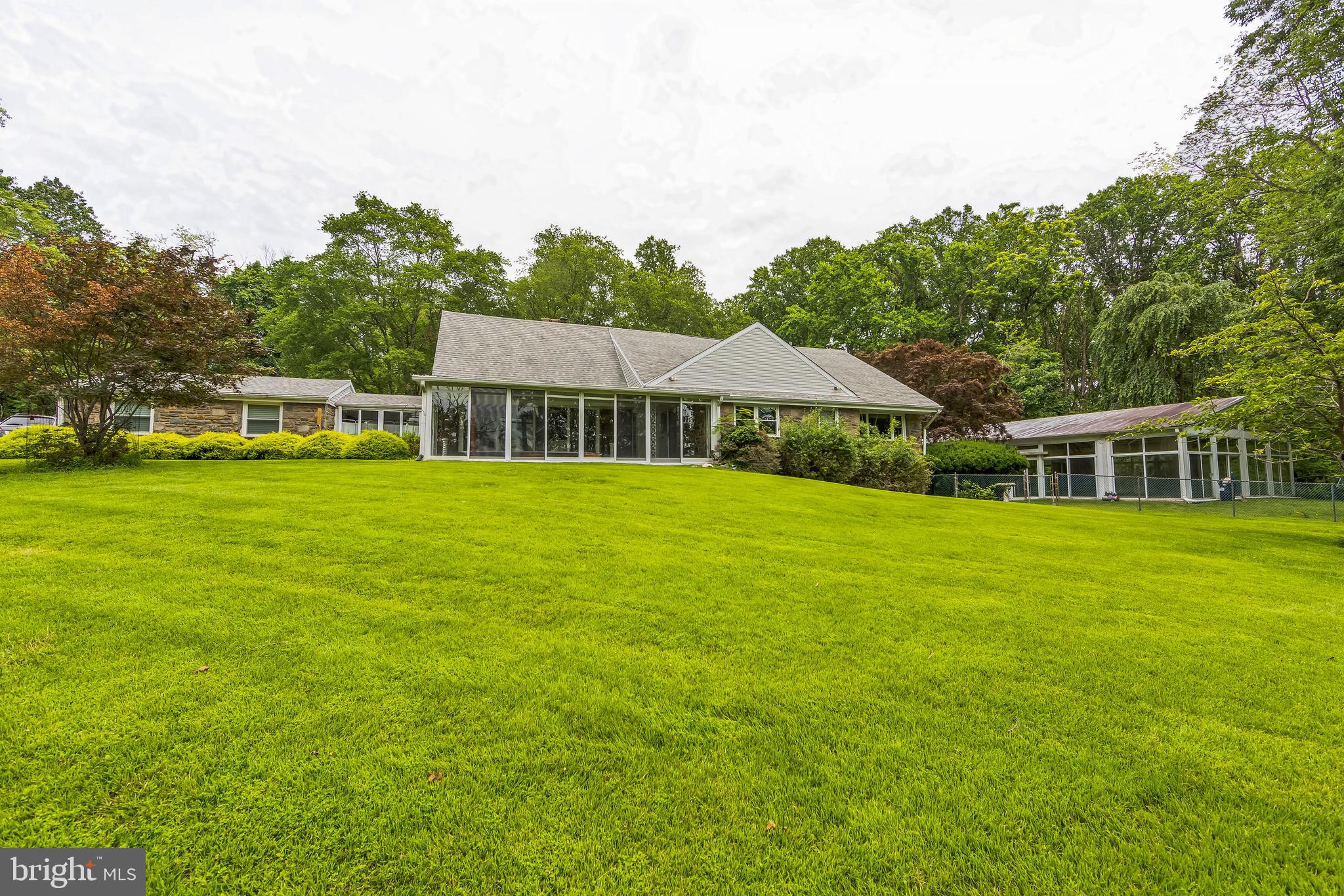 Custom built stone ranch style home sitting up on top of a hill overlooking Springton Reservoir with a detached 4 car garage and enclosed in ground pool on 7.37 wooded acres. Tons of opportunity to renovate with this well-built custom home situated on one the largest remaining lots in Media. A recent engineering yield study shows the potential for an additional home on a separate lot OR a potential 3-lot subdivision if the existing home is torn down. Property is being sold is as-is, where-is. Buyer to do their own due diligence with the township.