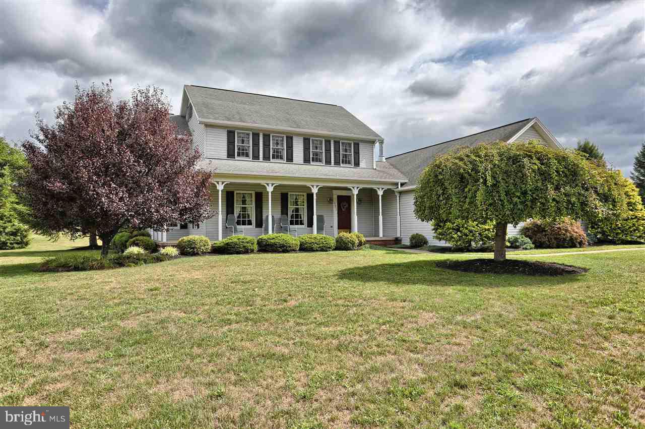 Welcome home to your beautifully maintained 4 bedroom 2.5 bath home on a clear, level 1.95 acre lot. Enjoy stunning views of the mountain from the wraparound porch. Great home for entertaining, large eat in kitchen, formal dining, family room w/ cathedral ceiling & gas fireplace, large finished basement w/ bar. Enjoy dinners on the covered patio. Also features remodeled master bath, oversized 2 car garage& Geothermal Heat.