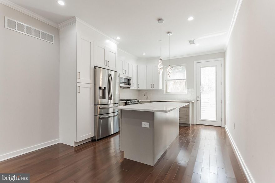 New construction stunner built by a Premier Boutique Builder with incredible attention to detail. This three story, all brick facade home with large windows boasts 4 bedroom and 3 full baths. First Floor: Open floor plan, spacious and bright living room and dining room with high ceilings and hardwood floors. A tastefully done contemporary kitchen with tons of 42 inch cabinets and self-closing drawers, quartz counter tops, glass backsplash and stainless steel appliances . A back door with built in blinds leads you to a nice size private yard with all new fencing. Second Floor: A custom iron railing staircase with illuminated lights leads you to the second floor where you will find two nice size Bedrooms with great closet space, a laundry room and a spacious tile bath. Third Floor: Private Master Suite with a large walk in closet and spa-like bath. The Roof Deck has illuminated undercounted lighting. Basement: Fully finished with many possibilities including bedroom, office, movie room etc. The basement also features a beautiful full bath, extra storage space and a separate mechanical room. Some other amenities included: LED recess lighting throughout - two zoned HVAC system - 200 amp service - sprinkler system - Pex manifold - 50 gallon hot water heater - poured concrete foundation. Neighborhood: Very sought after with great neighbors, restaurants, coffee shops and parks. Easy access to all major and local transportation. A pristine property; come and have a look for yourself!