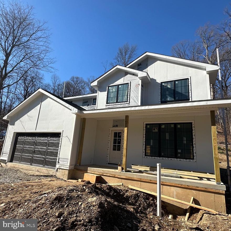 Stunning custom new construction home with wooded views in Malvern!!! Excellent location, private yet close to all that Malvern Borough has to offer. Your eyes will immediately go to the see through fireplace upon entering the foyer.  Well thought out floorplan is open with every square foot being utilized.  Kitchen opens to the family room with walls of windows. Four bedrooms, 3 full baths & 2 powder rooms plus a finished basement! Anderson windows throughout, this builder spared no expense.  There is nothing "builder grade" about this gorgeous home. Please note the first exterior picture online is a rendering- the actual home will have a white exterior.