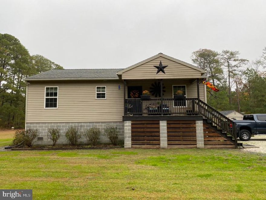 RECREATION HOMESITE!!! Charming, well-maintained 1,066 sq ft home on 6.39 +- acres, and backs up to 20.96+- acres of state land and surrounded by forested land.  This empty, two-bedroom home has an open concept living space that simultaneous feels cozy and spacious.  The house is built on 10-course block foundation with an encapsulated crawl space.  The smaller, stained shed has a freezer and the adjacent deer cooler has three deer hangers. The larger shed is currently being used as a tool/storage shed and both sheds have electricity. The above-ground pool has been set in the ground and will convey with the property. There is also a second septic system to the right/south side of the house. Approximately 15 minutes to Rt 13, 22 minutes to Crisfield, and 25 minutes to Princess Anne, this property will give you privacy and seclusion while still being close to amenities and recreational opportunities the Eastern Shore is known for. Suitable as primary or secondary residence, or use as a rental.