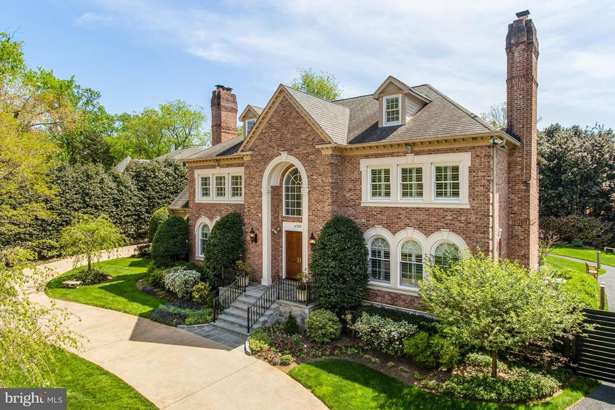 Introducing a spectacular 8 bedroom, 10 full and 2 half bath, all-brick custom-quality home situated on a lush, professionally landscaped private .5-acre lot in sought-after Langley Forest.  This extensively upgraded and meticulously maintained property offers luxury living in a private and serene setting and includes over 9,300 finished sq ft on 4 levels.   

The thoughtfully designed floor plan provides ample space for comfortable living and entertaining. Entering into the grand two-story marble foyer, with curved imperial staircase, the main level features formal living and dining rooms, each with a wood-burning fireplace, a sun-filled library with floor-to-ceiling custom built-ins and a spacious family room with a stone fireplace and wet bar and elevator access to the upper and lower floors. The intelligently reimagined BOWA kitchen is a focal point of the home, with Poggenpohl custom cabinetry, a large center island with seating for 5, Wolf 36” range and wall ovens, Sub-zero full-size refrigerator and freezer, Miele dishwashers, pot-filler, hot/cold filtered water and under-cabinet lighting. 

The spacious upper level of the home offers ultimate privacy among the four ensuite bedrooms. The luxurious primary suite is connected to a large sitting room with fireplace, with separate, his-and-hers walk-in closets, as well as his-and-hers bathrooms. A back hall leads to another private bedroom and across the upper landing, there is a 2-bedroom suite, with 2 full baths and a shared sitting area. There is an additional 4th level with 2 two ensuite bedrooms and wrap-around attic space. 

The lower level of the home offers ultimate flexibility with a recreation room with a fireplace, a kitchenette, and two additional ensuite bedrooms, which could also be used as a home-gym/yoga studio, craft room or home office. A back hall leads to the laundry room with three sets of new stackable W/Ds, two additional rooms and full bath, ideal for an au pair suite! 

A large slate patio, surrounded by mature landscaping and beautiful grassy area, offers luxurious privacy, accessed by the kitchen, family room and library. This space is perfect for outdoor entertaining, gardening, or simply enjoying the serenity.

Notable features include an elevator that services the three main levels, inlaid hardwood floors, plantation shutters throughout the home, a whole-house generator, central vacuum, intercom, robust security system and Anderson windows and doors, replaced in 2022. The 3-car side-load garage offers additional storage in a fully conditioned space. 

This exceptional home offers unparalleled luxury, privacy, and convenience in a highly desirable location. Located in the Langley High School pyramid, near Tysons Corner, downtown Washington, Dulles Airport, and major commuter routes.