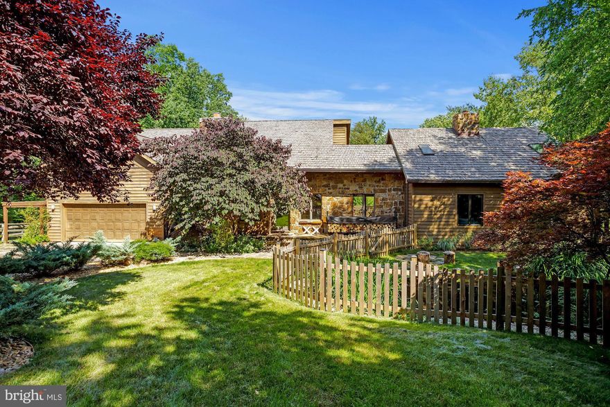 Wyld Wolf Farm | Welcome to your very own suburban oasis on 5 acres! This stunning property has it all: 4 BR/4.5 BA/5,100+ finished square foot contemporary home with finished basement and 2 car attached garage, in-ground pool, detached studio/garage, 5 stall barn, paddocks, pond, and chicken coop, as well as multiple outdoor entertaining areas! Inside the cedar and stone-front main home, you’ll find the most incredible primary suite with a cozy wood-burning fireplace, massive beams, large windows, multiple deck accesses, spa-like bathroom with waterfall showerhead and soaking tub, spacious walk-in closet with built-ins, sitting room, and a 2nd level loft! The large windows, hardwood floors, four floor-to-ceiling wood-burning stone fireplaces truly bring the outdoors in on every level. The finished basement offers a kitchenette, deck access, and ample space for work or play. Backs to Fountainhead Park with access to miles of riding and hiking trails. Only 45 min to DC, 7 min to VRE station! The cedar roof was replaced in 2015.