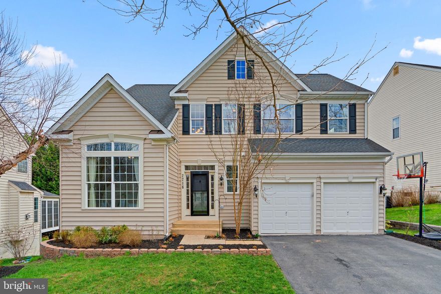 Nestled on a quiet cul-de-sac in sought-after Hollifield Estates, this 3496 sqft stunning north-facing Colonial offers premium, fully paid-off solar panels providing 100% annual energy offset, while the garage is equipped with a 220V plug, making it EV-charging-ready. Step inside to discover Brazilian hardwood floors and fresh paint throughout, creating a warm and inviting atmosphere. 

The impressive two-story foyer leads to a well-appointed study with vaulted ceilings and French doors, perfect for a home office. Across the hall, a stylish powder room adds convenience. The open-concept layout flows seamlessly, connecting the living room to the elegant formal dining room, highlighted by chair rail detailing and a chic chandelier. The upgraded eat-in kitchen is a chef’s delight, featuring modern cabinetry—some with glass fronts—gorgeous granite countertops, stainless steel appliances, a tile backsplash, pendant lighting, a spacious island, and a sunlit breakfast room with exterior access. The open and airy family room offers the perfect space to entertain, complete with south-facing windows and a cozy gas fireplace.

Upstairs, the expansive owner’s suite boasts a vaulted ceiling, a walk-in closet, and a luxurious en suite bath with dual sinks and a large corner soaking tub. The additional bedrooms are generously sized, and the upper level also includes another full bath and a convenient laundry room. The finished basement is a standout feature, offering a home theater setup with a projector, screen, and speakers. A full bath, an additional bedroom, and walk-out access to the backyard complete this versatile space.

Outside, the private, wooded backyard is perfect for relaxation and entertaining, featuring a spacious Trex® deck and lush tree-lined views for added privacy.