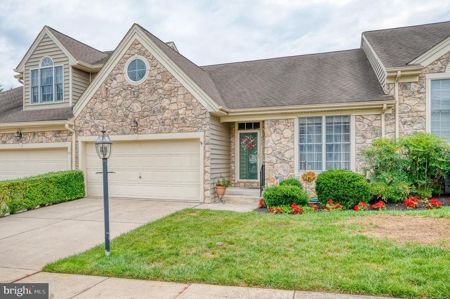 Rarely available in the Clark Turner Community of Millstone, this home has been meticulously maintained. A rancher style villa with two-car garage, it's situated in a 55+ community - ready for you to call it home. You'll find hardwood flooring upon entry with beautiful moldings accenting the neutral walls. The main level is complete with a large living room with 10' coffered ceilings, open kitchen with breakfast bar, 42" inch maple cabinetry and backsplash, laundry/mudroom just steps away with easy garage access. The primary bedroom has a tray ceiling, moldings, two closets and renovated bathroom with jacuzzi tub, separate shower and grab bars. The second bedroom has access to the dual entry bathroom - ideal for guests. There is a maintenance-free deck with solar lights accessed by sliders. The walkout lower level is finished and includes a spacious family room, half bath (space to make it a full), bedroom/office with built-in shelving, ample storage and paver patio backing to trees. You'll find decorative columns, surround sound, new HVAC 2021; and hot water heater (2016). Convenient to Bel Air and commuting routes. There is a community gazebo and the HOA includes lawn maintenance, trash and snow removal.
Open Saturday and Sunday!