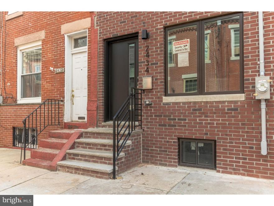 Check out this amazing Graduate Hospital rehabbed home offering 3 bedrooms, 2.5 bathrooms, a patio, a balcony, and a roof deck! Walk through the front door into the open first floor. The living room has natural hardwood floors with recessed lighting and large front windows. Past the living room, you'll pass a half bath as you step into modern kitchen - showing off with its white shaker-style cabinets, carrera marble counter tops, built-in stainless steel appliances, grey subway tile backsplash. Up the stairs to the second floor is where you'll find two good-sized bedrooms each with a soft gray and white color palette, ample closet space, recessed lighting, and brand new windows. This floor also houses a beautiful full bath with modern features including large subway tiles and Mosaic accent and modern shower fixtures. Enjoy stress-free days in the spacious master suite located on the top floor with bonus reading/office area. This floor provides tons of natural light stemming from the sliding glass door leading to the balcony and a large master bathroom offering a double vanity and large glass-encased stall shower. The full size roof deck has a 360 degree view of the city with skyline views! You can also enjoy ground-level outdoor fun on the private rear patio. Need more living space? The basement is fully finished with modern wood look tiling. This home has quick access to I-76, UPENN, Drexel, the Schuylkill River Trail, and Center City!