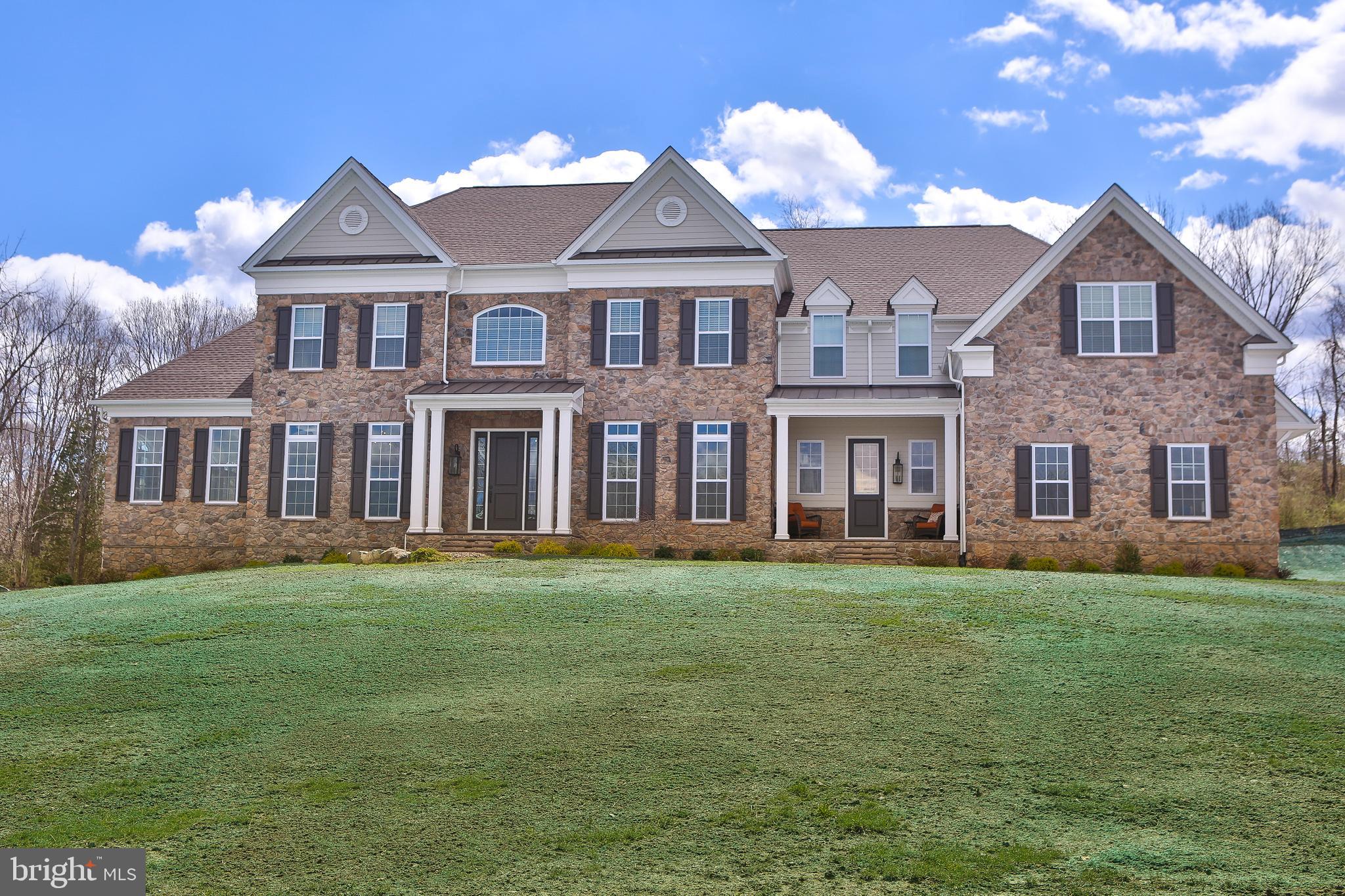 Welcome to the best of both worlds, this 1 year old Toll Brothers Weatherstone model still has that "new house" smell without the wait of new construction. Located in the coveted Enclave of Dutchess Farm Estates, this home boasts upgrades throughout, including structural upgrades that make this a one-of-a-kind find. With a breath taking view of the mountain on the outside, the inside makes the 6,252 square foot, 5 bedroom, 5 bathroom home still feel cozy. The attention to detail is immediately apparent as you walk into the home. The first floor has hardwood floors throughout. The extra ceiling height and widened hallways on all levels, makes this home feel very open and is light-filled. The gourmet kitchen boasts cabinetry to the ceiling along with large pantry with closet organizers and stainless steel, high end appliance to make any chef jealous.The expansive center island has plenty of room for seating and is open to the breakfast area and family room. The family room has been expanded and is filled with windows overlooking the rear yard and has a beautiful stone fireplace. Off the kitchen there is a well placed homework/hobby nook for easy access to help the kids or for doing your own special projects. Encounter a spacious dining room with butlers pantry and the library/office with built in bookcases in the front of the home. To complete the first floor there is a spacious conservatory that can be used as a billiards/game room or just a place to stare off into the gorgeous outdoor scenery. Needing a first floor bedroom or extra office/playroom? The first floor guest bedroom/In-law suite has a full bath and walk-in closet but can be used however may work best for you. Lastly find an expanded mudroom with access from both the garage or separate access door. Be wowed by the built-in bench and cubbies. The second floor is accessed from either the grand front staircase or the staircase off of the kitchen. Each bedroom in the home has it's own full bathroom with upgraded tile and fixtures along with large closets with closet organizers and ceiling fans.The master bedroom is a monument of design and functionality with a closet that not only stores clothes and shoes but showcases them. The sitting area is spacious and the master bath boasts a stand alone tub and expanded shower. The second floor is complete with a large laundry room and a bonus room that would make a perfect man cave or she-shed. It also has a closet for storing games, toys of clothing if you choose to make this another bedroom. The upgrades to the three car garage include upgraded beams to alleviate the need for any posts and have over-sized garage doors and extra width. One foot higher and one foot wider than standard garage doors. The unfinished walk out basement was built with extra height and is "pre-plumbed" for a full bathroom and is a blank canvas for you to create extra living space. No detail was overlooked! Don't hesitate to come see this home, it will not disappoint. *This neighborhood attends the sought after SOL FEINSTONE elementary school.
