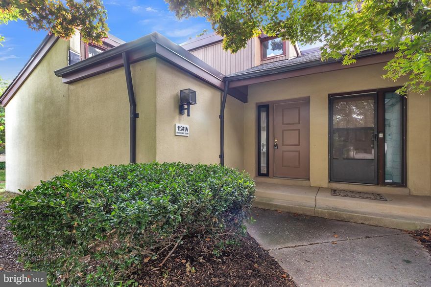 Welcome to 11241 A Snowflake Ct, Columbia, MD where an abundance of natural light fills every corner, creating a warm and inviting atmosphere. Step inside the first-floor owner's suite with a beautifully updated, custom tiled bathroom, vaulted ceilings, and walk in closet with custom built-ins, providing an oasis of tranquility and relaxation. You'll love waking up to the soothing ambiance of this serene space. The light-filled open floor plan is an entertainer's dream, seamlessly connecting the living, dining and kitchen areas. The living room features a wood burning fireplace with vaulted ceilings and clerestory windows. The adjacent dining area is table-spaced and light filled with a SGD leading to the private courtyard patio, perfect for outdoor dining, relaxing, or gardening. The kitchen is a chef's delight, featuring an 8-foot peninsula island, gorgeous quartz countertops, a stunning marble backsplash, new cabinetry, stainless steel appliances, and an additional SGD to the patio. The second level features two additional spacious bedrooms, one overlooking the living room, and updated full bath, ensuring ample space for family or guests. Separate laundry room on main level. This completely renovated three bedroom, two bath townhome offers a perfect blend of style, space, and convenience. If you're seeking a contemporary, move-in ready home with high-end finishes and a central location, this is it!