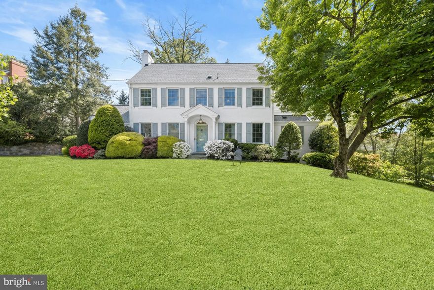 Set on a prominent 0.3 acre corner lot in the highly sought-after Sumner neighborhood, 4700 Fort Sumner Drive offers a rare blend of classic center hall colonial architecture and extensive recent updates, delivering a home that feels both timeless and move-in ready. Inside, a gracious center hall layout opens to expansive yet comfortable living spaces. The front-to-back living room is anchored by a wood-burning fireplace and flows seamlessly to the outdoor entertaining areas. The formal dining room features classic millwork and updated lighting, ideal for both intimate dinners and larger gatherings. The kitchen, redesigned as part of a recent renovation, spans the rear of the home and is both functional and inviting. A skylit breakfast area overlooks the expansive  backyard, while updated cabinetry, appliances, lighting, and generous prep space make it a true hub of the home. The main level also includes a welcoming family room with a second fireplace and custom built-ins, along with two powder rooms. A standout feature is the private, soundproofed office with its own side entrance—perfect for working from home or meeting clients.
The second level offers four spacious bedrooms and three full baths, including a well-appointed primary suite with a walk-in closet and en suite bath. The third level provides two additional large bedrooms and an updated full bath, offering flexible space for guests, au pair, or home offices. The lower level adds versatility with a recreation room featuring a third fireplace, a dedicated workshop, mudroom, and direct access to the attached two-car garage with EV charging.
Located just off Massachusetts Avenue, Sumner is known for its strong community feel and easy access to parks, trails, shopping, and commuter routes. The home is also part of the highly regarded Wood Acres, Pyle, and Whitman school cluster.
A beautifully updated home with space, flexibility, and enduring appeal in one of the area’s most desirable neighborhoods.