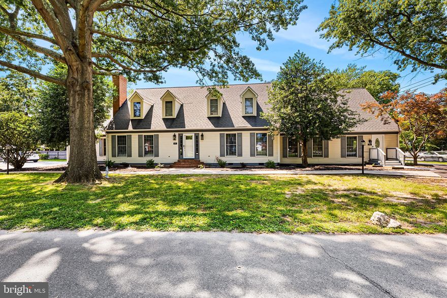 Welcome to 603 Walnut Lane in beautiful Easton MD! This enchanting cape cod home with attached guest cottage is located in a peaceful and picturesque neighborhood of Easton and is sure to impress with its exceptional design and thoughtful features. Fully renovated in 2022, this charming 1986 built, two story home is situated on a .28 acre lot this and features over 4,000 finished square feet with a total of 6 bedrooms, 4 full baths, attached 2 car garage parking, deck and separate driveways.  The exterior of this home boasts an elegant and timeless architectural style with large inviting windows and dormers that adorn the front of the house, allowing abundant natural light to flood the interior and showcasing the home's character. Step inside and be greeted by a meticulously designed interior that exudes warmth and sophistication. The timeless and elegant floor plan creates a seamless flow between the different living spaces, promoting a sense of spaciousness and connectivity. The attention to detail is evident throughout, with hardwood flooring that span the main level adding a touch of rustic charm to the interior. This home offers a generous living room, perfect for entertaining or spending quality time with family and friends including a cozy fireplace, creating a welcoming atmosphere on cooler evenings. The adjacent dining area provides an ideal setting for formal dinners or casual gatherings, while large windows invite natural light to illuminate the space. Prepare to be impressed by the fully renovated eat in kitchen in featuring stainless appliances, granite countertops, wine fridge and beautiful cabinetry. With ample counter space and storage, the kitchen is both functional and aesthetically pleasing, making it a chef's dream. Entertaining will be effortless on your deck overlooking landscpaed and fenced back yard, providing a private retreat to unwind and enjoy the outdoors. The main level features two bedrooms and two full bathrooms thoughtfully designed to provide comfort and privacy. The main level primary suite with private bath is an ideal setup for individuals looking for single-level living. The upper level features two additional and comfortable bedrooms, that share a full bath. Dormer windows in the upper level bedrooms add architectural interest to the interior while creating cozy alcoves for relaxation. The attached guest cottage, with private entrance compliments the main residence’s architectural style. This two-bedroom, full bath attached guest cottage features beautiful hardwoods, full kitchen, living room, private driveway, and separate utilities. This guest cottage is a cozy retreat that can be used as a short term rental offering guests a memorable stay or to accommodate family members or guests while providing them with a level of independence and comfort. Seller is currently using the guest cottage for short term rentals which has been approved by the Town of Easton. Whether you're enjoying the main house's comfort or hosting guests in the guest cottage, this property is sure to create lasting memories for years to come and is just minutes from historic downtown Easton. Easton MD is a captivating destination that offers a harmonious blend of history, culture, and natural beauty. Whether you're strolling along its historic streets, exploring the arts, dining or enjoying waterfront activities, Easton welcomes you with its distinct Eastern Shore hospitality and a genuine sense of community. Welcome home!