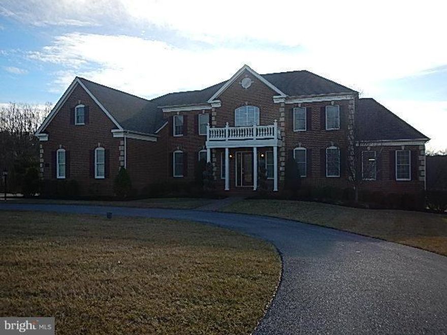 Spectacular 6600 sq. feet  plus home with basement ready for your customization.Elegant home welcomes you with grand marble Foyer, & 2 circular staircases. Relax in a 2-story Family Rm w/ coiffured ceilings & a stone fireplace, or in the Chef's Kitchen. Escape to the private study or master suite by elevator service or private back stair. All brick.  $750,000 less than when new.