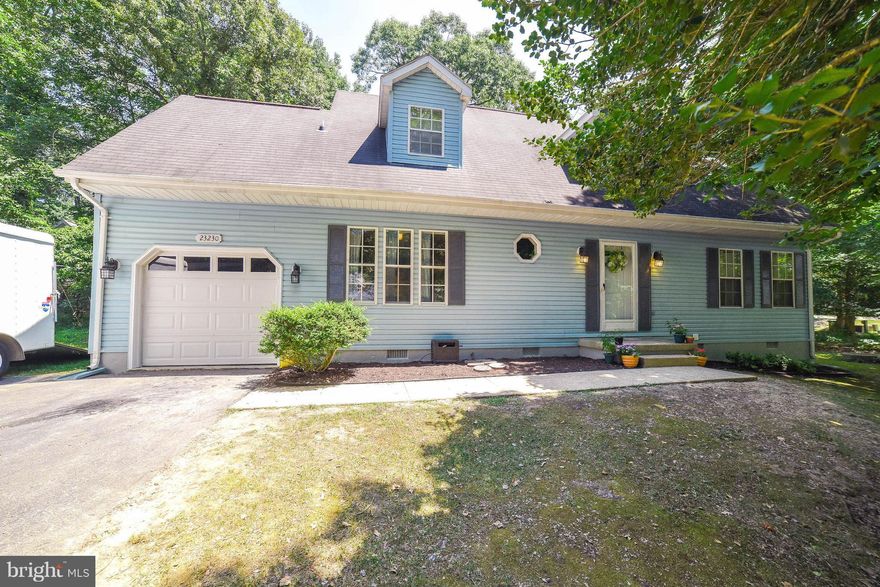Delightful Wildewood Cape Cod has main-level BR, family rm w/FP, den/office, sep DR! Attractive kitchen w/cherry cabinets, hdwd entry, new laminate in FR/DR, white painted trim. 2 big BRs + full bath upstairs; 1 BR has WIC, other, 2 closets. Garage w/pull-down attic stairs, 12x16 deck on oversized .44 acre lot! Evergreen Elem, neighborhood w/playground & rec fields, walk/jog lanes; can join pool!