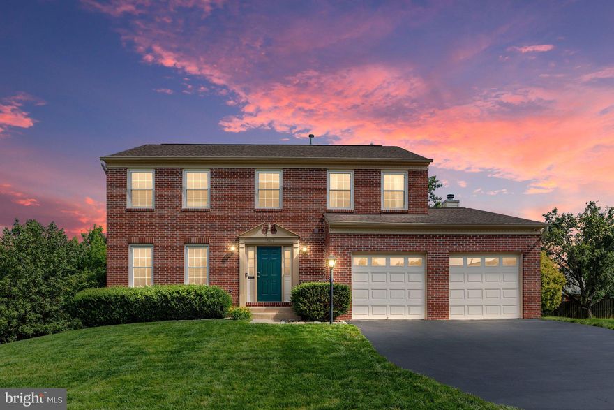 Come see this beautifully remodeled home on a cul-de-sac!  This brick-front home has a gorgeous 2020 kitchen remodel you will love, and almost 2900 finished sq ft of living space.  Walk in the front door and enjoy the spacious two-story foyer and notice the entire main level has luxury vinyl plank flooring.  Go through the living room and grab a drink at the kitchen bar, or hang out at the huge island. This light and bright kitchen has quartz counters, tile backsplash, and stainless appliances, plus room for a table - and don't forget to check out the nice pantry! The family room has a wood-burning fireplace with mantle and ceiling fan. Walk out the sliding glass doors to enjoy the large composite deck with stairs to the backyard.  Upstairs, the primary suite has hardwood floors, a ceiling fan, an attached bath with updated tile shower, soaking tub, and dual sinks.  There are 3 more bedrooms and an additional bath on the upper level. The walkout lower level was completed in 2016 and also has luxury vinyl plank throughout. The basement has a wet bar and space for a beverage fridge, recessed lighting, and a spacious storage room behind a door - perfect to hide all your stuff. The fenced backyard has a stamped concrete patio and covered space under the deck so you can hang out in the shade.  Some hidden features and upgrades you might not notice at first glance are the Alexa-enabled main-level lighting and the ample foyer closet with the hanging/storage system. Plus, the furnace, humidifier and A/C units were replaced in 2020, and windows were upgraded to vinyl in 2015. Move in and enjoy!