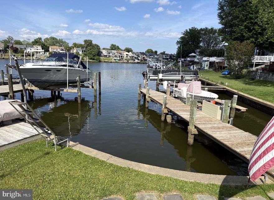 Welcome to 3 Old Sound Road, a beautifully updated WATERFRONT retreat located in sought after Rumsey Island. This exceptional home offers the perfect blend of modern updates and serene waterfront living.
The main level features a spacious primary suite with a new en-suite bath, walk in closet, and ample space for a home office or sitting area. Sliding doors lead to a deck with breathtaking waterfront views. Two additional, nice sized bedrooms are also located on the main level

The heart of the home is the large newly updated kitchen, complete with granite countertops, room for a large table, ample cabinet space, and seamless flow into the expansive family room. Vaulted ceilings, abundant windows, and French doors create a bright, open atmosphere and leads to a fully renovated, maintenance free deck that stretches the width of the house. This deck is composite. Take the spiral steps down to the rear yard.

The lower level offers a cozy wood burning fireplace, sliding doors to a large, enclosed sunroom, a powder room and a large closet. This space is ideal for entertaining or relaxing after a day on the water. The door to the garage is in the lower level.

Additional highlights include new vinyl flooring through most of the house, a new low-maintenance fence, a J-Plug/30 amp outlet for hybrid or electric vehicle, and a lower deck close to the water with newer boards and joists. The pier was replaced in 2025 and features water and electric.  Pier is 5 1/2 foot wide and over 50' long. Rear yard hardscaping was complete in 2025, creating an inviting outdoor oasis. 
Large 2 car garage, extra space for water toys, large driveway and a large inside storage area for your water supplies
This turnkey waterfront home is a rare opportunity to enjoy island living at its finest
This location is ideal for swimming, paddle boarding, kayaking, boating, jet skiing, etc. Quick access to Gunpowder RIver and out to the bay

The house comes with its own dinghy dock with lift