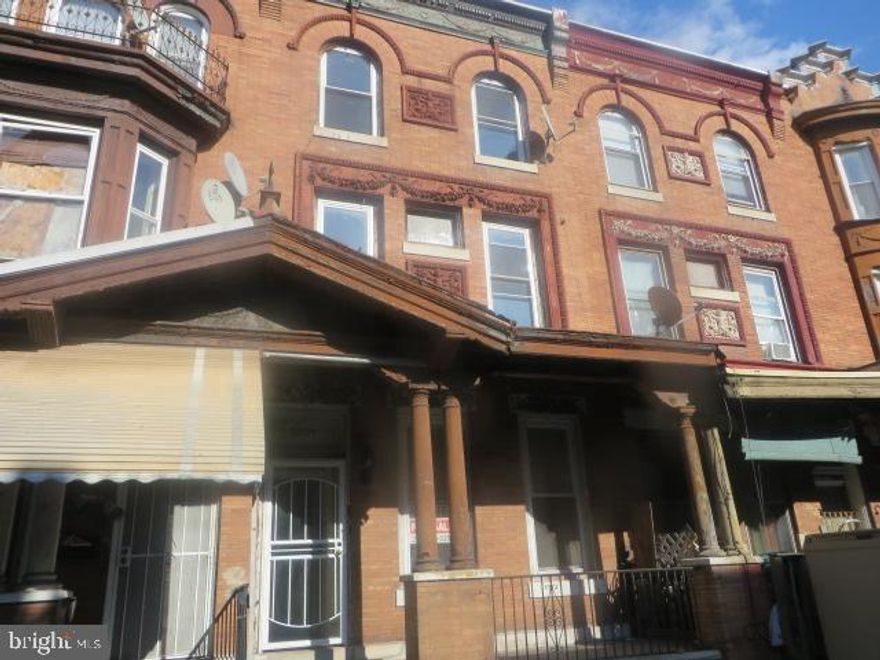Three story, porch front row located just off of Broad Street and close to Temple university Hospital. Property is set up for three units with a two bedroom apartment on the 1st floor, a two bedroom apartment on the 2nd floor and a one bedroom apartment on the 3rd floor. All units have central air and separate utilities. Tremendous rental potential. Property being sold strictly As Is.