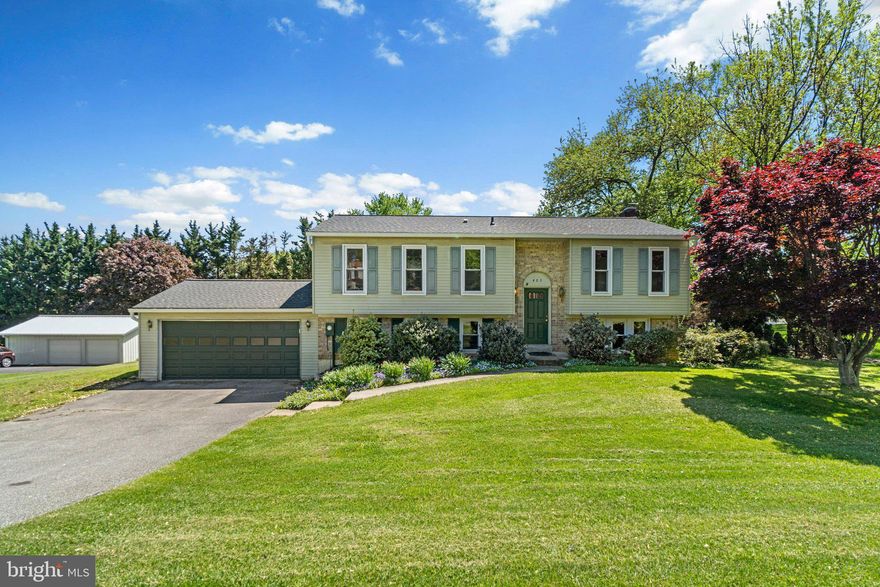 Welcome to 403 Ronsdale Road! This beautiful and well maintained 4 bedroom, 3 full bath, split foyer is nestled on just over half an acre in a desirable neighborhood just steps away from top ranked schools! Three bedrooms are located on the upper level w/ the entire house recently newly carpeted and freshly painted throughout. Kitchen boasts hardwood flooring and connects to dining area and living room. Upper level also includes 2 recently updated full bathrooms including one connecting to the primary bedroom. The lower level offers a large family room, a cozy fireplace, its own full bath, and finished fourth bedroom. Lower level also provides interior access to the attached 2 car garage from utility/storage area. Rear lot spacious and flat perfect for all your family gatherings! Recent updates include New carpet and paint entire home, Water Heater and sump pump  2024,  Remodeled bathrooms upper level 2024, New Roof and Gutters 2022, Furnace is from 2015, Slider replaced 2016, Well pump/holding tank/casing 2016,