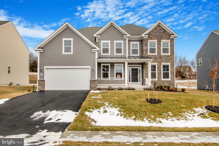 Your dream home awaits at 9343 Alloway Drive in Hagerstown! 

This is more than just a house—it’s an opportunity to own a home built with love, care, and intention. Originally designed as a forever retreat for an active-duty military family, plans unexpectedly
changed due to an injury sustained in service. Though never occupied, this stunning
home is ready to welcome its first owner. Now, the sellers are highly motivated and
eager to pass it on to someone who will cherish it. With this unbeatable price and seller
incentives, this is the chance of a lifetime.

Nestled in the prestigious Westfield neighborhood, this home offers the perfect blend of
small-town charm and modern convenience. Surrounded by breathtaking mountain
views and lush landscapes, yet just 65 miles from Washington, DC, you get the best of
both worlds—peaceful suburban living with effortless access to major metropolitan
hubs. Imagine waking up to scenic beauty while knowing you’re only an hour’s drive
from the heart of the nation’s capital. This home is perfect for commuters, nature lovers,
and those seeking a vibrant community.

Step through the grand two-story foyer, and you’ll immediately be captivated by the
home’s elegance and thoughtful design. The formal dining room boasts upgraded
lighting, setting the stage for memorable dinner parties. The sun-drenched living room
invites you to relax, while the expansive two-story family room is the true heart of the
home. A stacked-stone fireplace creates a cozy yet sophisticated ambiance, perfect for
quiet evenings or lively gatherings. The chef’s dream kitchen features GE stainless steel
appliances, an oversized chef’s island ideal for meal prep and entertaining, and 42-inch
solid wood cabinetry for ample storage and timeless style. A versatile main-level bonus
room offers endless possibilities as a home office, library, or even a first-floor bedroom.
A well-placed powder room ensures guest convenience.

Ascend the grand staircase, and you’ll find a light-filled second level designed for
comfort and luxury. A dramatic overlook floods the family room with natural light,
creating an open and airy atmosphere. Three spacious bedrooms ensure plenty of
space for family and guests. A well-appointed family bathroom and centrally located
laundry room provide modern convenience. The primary suite is a true retreat, featuring
an elegant double-door entry, plush carpeting, and abundant natural light. The spa-like
ensuite includes a two-person soaking tub, steam shower, and dual-sink vanity, creating
a space of relaxation and comfort.

With nearly 4,000 square feet of finished space, this home already offers an impressive
layout. But there’s more. The full-length lower level is a blank canvas ready for your
vision. With the potential to add over 1,000 square feet of additional living space, this
area is perfect for a home theater, gym, wine cellar, or extra bedrooms. A pre-planned
full bathroom makes customization easy. The sellers are even offering a credit for
basement completion with an accepted offer by 2/15.

Beyond the stunning home, the Westfield community offers unmatched amenities,
including scenic walking trails, tennis courts, and a community pool perfect for hot
summer days. With an elevated stone-front façade, oversized two-car garage, and
prime location, this home is as functional as it is beautiful.

This home has been priced to sell, and the sellers are offering incredible incentives to
make a deal happen quickly. Schedule your private tour today before this opportunity is
gone.