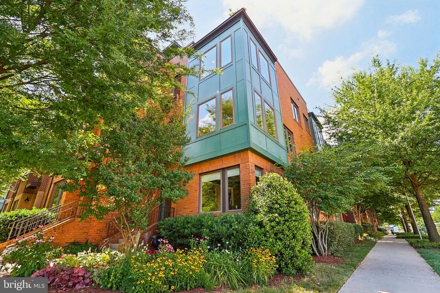 You’ve been waiting for so long and now the wait is over! Imagine waking up every day in your dream home, a luxurious Cameron model townhouse in the heart of the Mosaic District. This corner-unit gem is a rare find as only 4 of these models were built, offering the perfect blend of space, privacy, and modern amenities that discerning homeowners seek. 

The Cameron model is the largest townhouse in this Mosaic development, with an expansive floor plan that is both wider and longer than other units. Its distinction as the only model with a full roof deck sets it apart, providing an exclusive urban oasis right at home. This model’s clever offset design ensures unparalleled privacy, with no adjoining walls in the master bedroom and family room, and an abundance of windows allowing for natural light to fill the space throughout the day. Step inside to find a home that is both LEED Certified and exquisitely appointed with hardwood floors, 9-foot ceilings, custom blinds, water ionizer for laundry, new HVAC in 2023, and so much more!

The first floor welcomes you with a large foyer entry, an office/study, a bedroom with an ensuite full bath, and a large two-car rear entry garage. 

The second floor offers an open floor plan with walls of windows providing sweeping views. The spacious living and dining rooms flow seamlessly into the renovated kitchen, making it an ideal space for both daily living and entertaining. The kitchen is a chef’s delight, featuring quartz countertops updated in 2022, a custom black walnut island countertop added in 2023, and handmade English pewter hardware adorning the abundant 42-inch cabinets. 

On the third floor, the generously sized primary bedroom features a large walk-in closet, and an ensuite bath with a double vanity and heated floors, ensuring comfort and luxury. Two additional bedrooms, a full hall bath, and a separate laundry room with natural light complete this level. 

Entertain guests with ease on the largest private rooftop terrace in the community with expansive views, complete with a hose bib for gardening, a gas hookup for grilling, and ample space for lounge chairs, a patio table, and more. The terrace is the perfect spot for people-watching, dining, and relaxing under the open sky and stars.

Beyond this stunning townhouse, the vibrant Mosaic District awaits. The district is a hub of activity with a farmer’s market, fabulous restaurants, shopping, interactive fountains, live music, outdoor films, and the popular Angelika Film Center. For those commuting, the courtesy shuttle to one of the nearby Metro stations and easy access to I-66 and I-495 make getting around a breeze.

Take advantage of the HOA amenities, including access to the adjacent Avalon world-class gym, pool, and common areas with grills. 

Seize this rare opportunity to own one of only four Cameron models in the Mosaic District, where every detail has been thoughtfully designed to enhance your lifestyle. This is not just a home; it’s a statement of elegance and sophistication.