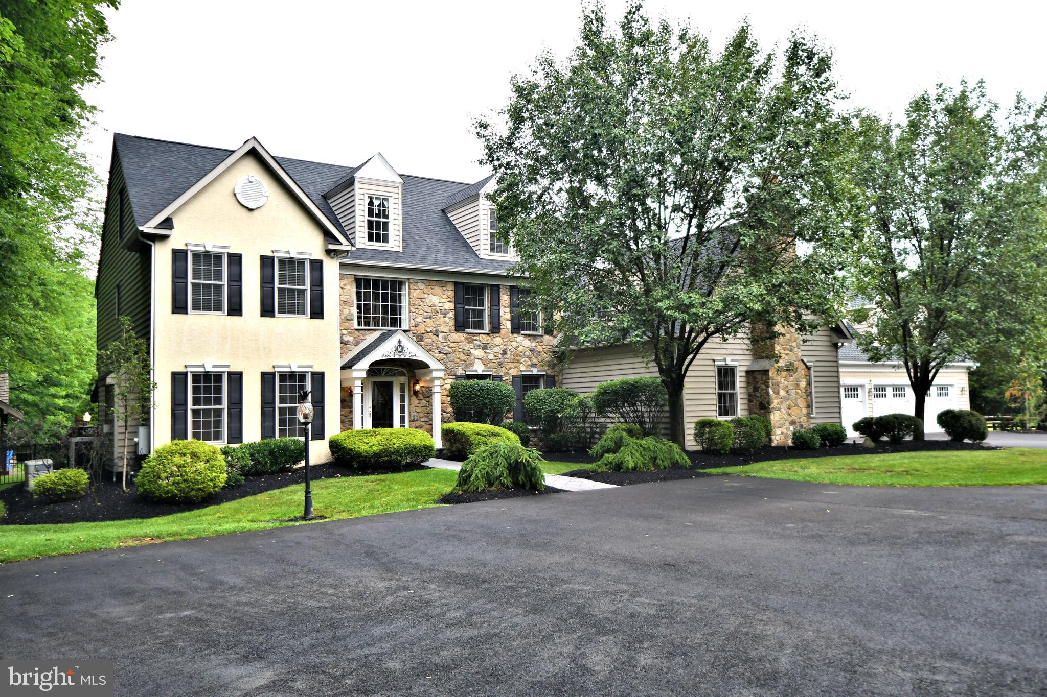 Spectacular!!! This magnificent stone front colonial sits on 2-impeccable acres!! Driving down the private long driveway you will discover paradise. Entering the front door you discover a stunning three story foyer with 5" hardwood flooring. To the left is a lively living room with gas fireplace. To the right is a formal dining room with wainscoting. Straight ahead is a fabulous two story family room with gas fireplace and the wall of windows overlooking the fabulous backyard. The gourmet kitchen features Viking appliances (Refrigerator, double oven), granite counter tops, recessed lighting, and a bright roomy breakfast room. Off the kitchen is a butler pantry with wet bar, a walk-in pantry, and the tremendous great room with gas fireplace. There is also a private study with glass doors and built-in bookshelves. Upstairs we have the tremendous master bedroom with sitting rooms, a huge walk-in closet, and a lavish ensuite. There also three more bedrooms, one is a princess or prince suite, and two other roomy bedrooms. The third floor has two bedrooms with half bathrooms. Downstairs is the outstanding finished basement great for entertaining. A workout room, a private theater room, and plenty of storage. Now we come to the fabulous pool area with over 3500 of decking that is stone and concrete. There's a oversized cabana house with full bathroom, bar area, changing room, and storage area. On the other side of the pool is an oversized bar that could seat 15, refrigerators, wine refrigerator, and beer taps. There is also 25' x 25' garden and storage house, a trampoline, and behind that is a pond. Above the three car garage is an awesome work room or office space, It has air conditioning, heat, and a kitchen area. Off of the garage is a oversized shed. There is so much more to see!! Don't miss this gem!