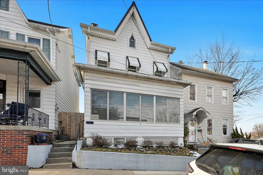 Welcome to 202 High St, Schuylkill Haven! The enclosed front porch warmly welcomes you into this charming home. The first floor features a spacious, open living and dining room area with 9-foot ceilings, original hardwood flooring, and beautiful built-ins that add character and charm. The kitchen offers a cozy breakfast nook, corner built-in cabinet, newer appliances, and a convenient side door providing access to the side porch and fenced-in backyard. A mudroom with additional storage, pantry space, and a half bath completes the main level. Upstairs, the second floor includes three private bedrooms, a separate walk-in closet, a full bathroom, and access to a covered side porch. The third floor provides a full attic, perfect for additional storage. Recent improvements include a newer metal roof  installed in 2019, new replacement windows 2020 & 2022, and updated appliances. The fenced-in backyard also features a storage shed for added convenience. Ideally located close to town, schools, parks, and local amenities, this home offers both comfort and convenience.