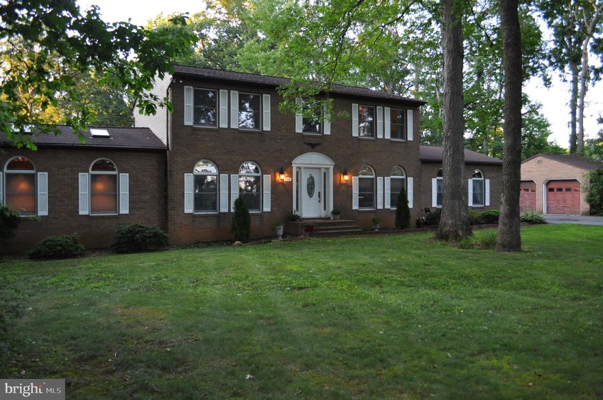 Don't miss your chance to see this spacious 4 Bed 3.5 Bath Home today!  Looking for Privacy look no further.  This Beautiful all BRICK 2 story sits on a private 1.29 Acre lot.  Enjoy the view from your huge composite deck overlooking your inground pool.   Home boasts Large rooms with a vaulted ceiling in the family room, Hardwood floors through out the first floor.   Sunroom added in 2008.  A fully finished basement gives you great additional living space.  The house has a 3 car attached garage and a 2 car detached garage, great for additional storage and projects.  Great location for going into Westminster or heading towards Baltimore via Rt 30.  HVAC and water heater replaced in the last 5 years.   Roof replaced in the last 10 years.   Upstairs heat pump replaced 2023 and pool liner is in the process of being replaced.