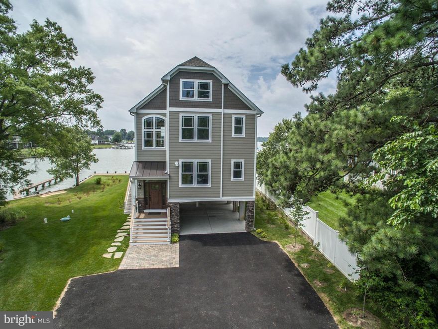 TRULY ONE OF A KIND--WRAPPED WITH WATER VIEWS--CUSTOM DESIGNED HOME--COASTAL INSPIRED--TAKING ADVANTAGE OF 400+ FT OF WATERFRONT--ENJOY MAGNIFICENT SUNSETS--VIEWS FROM EVERY WINDOW--HIGH CEILINGS--FLOOR TO CEILING STONE FIREPLACE--LOTS OF NATURAL LIGHT/OPEN FLOORPLAN--PRIVATE SETTING W/WATER ON THREE SIDES--DEEP WATER--BULKHEAD/PIER FOR LARGE OR SMALL BOATS--VACATION FROM HOME!