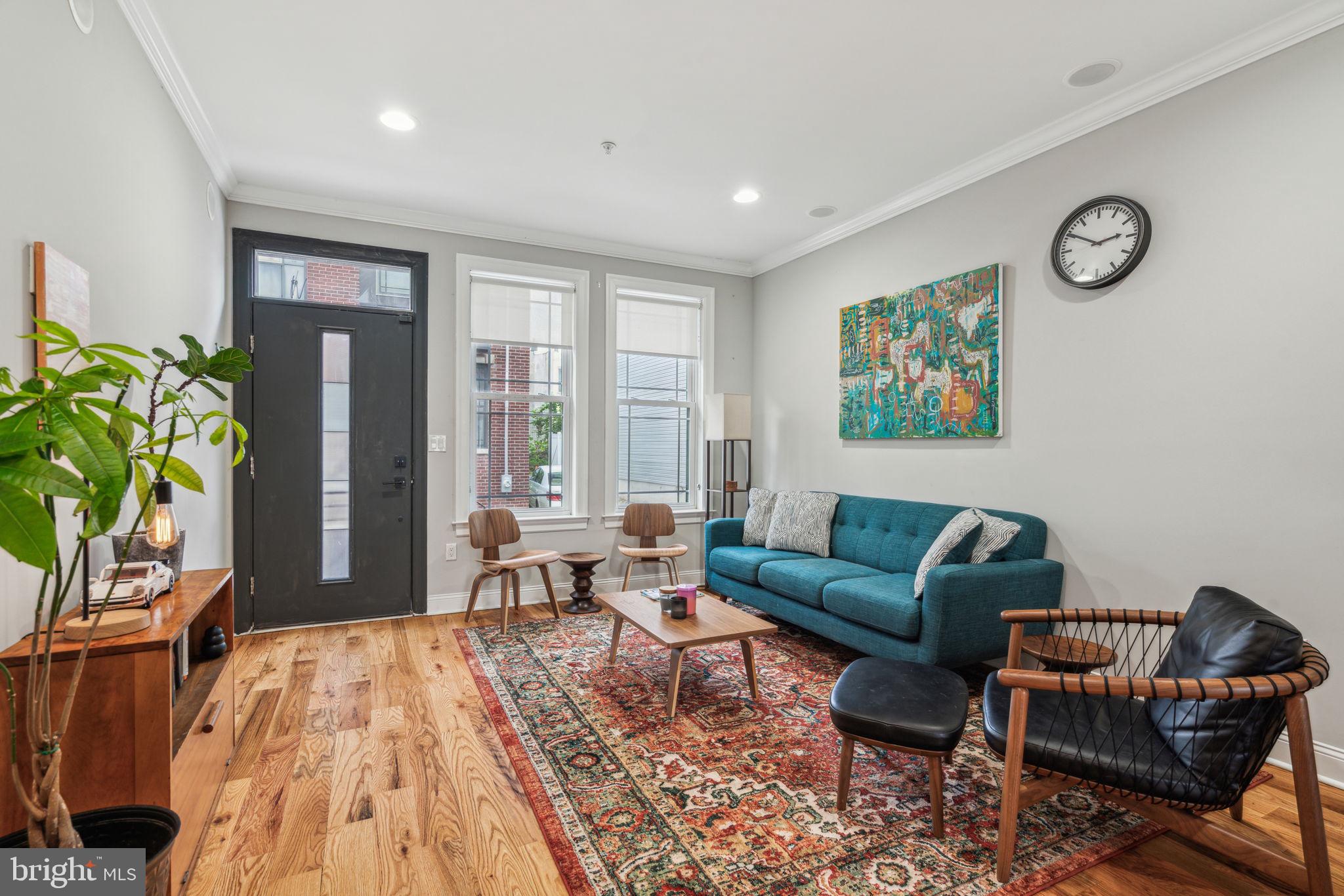 Welcome to 1444 N Myrtlewood Street—a newer construction townhome in the heart of Brewerytown offering space, style, and strong walkability. The open-concept main level features wide-plank flooring and a sleek kitchen with quartz countertops, shaker-style soft-close cabinetry, and stainless steel appliances. Just beyond, a private fenced-in yard offers space to grill, garden, or relax. The finished basement adds a fourth bedroom, full bathroom, and bonus living or storage space—ideal for guests, a home office, or gym. Upstairs, you’ll find two bright bedrooms with generous closets, a full hall bath, and a conveniently located washer and dryer. The third floor is a full primary suite with a wet bar and a stunning en-suite bath featuring floor-to-ceiling tile, dual vanities, and an oversized glass-enclosed shower. On top, a full rooftop deck offers panoramic Center City views—perfect for entertaining or unwinding. There are approximately four years remaining on the original 10-year tax abatement. Located just blocks from Fairmount Park and steps from some of Brewerytown’s best spots along Girard Avenue, with easy access to I-76, I-95, and public transit. Whether you’re looking for a spacious home or a smart investment, this one checks all the boxes.