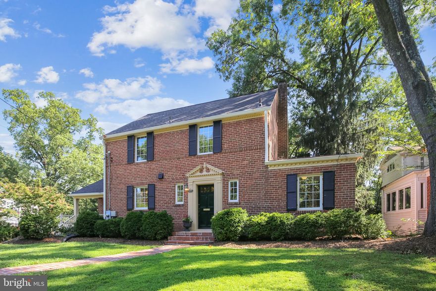 OUTSTANDING OPPORTUNITY IN CHOICE NEIGHBORHOOD OF LUXURY HOMES. Traditional custom brick colonial on premium quarter-acre plus, updated and move-in ready yet ripe for major expansion and or additional remodeling. Ideally sited on commanding high ground overlooking beautifully landscaped Fort C.M. Smith Park directly across the street. Unbeatable proximity to DC, with Foggy Bottom, the Kennedy Center, Georgetown and other downtown destinations all within a few minutes' ride by car.  

The home offers four bedrooms, three full baths, and one half bath. On the main level, a gracious foyer entry with curved walls opens expansive 28-foot living and dining area stretching across the back of the house and opening to a 25 x 12 deck. The gourmet kitchen features Cambria quartz counters, a farm sink, lighted cabinets with glass doors, and a 6-burner Wolf gas range and other high-end appliances. There is also a charming sun room addition and a guest bedroom with adjoining full bath.

Upstairs are three additional bedrooms and two full baths, including an expansive ensuite owner's bath. The lower level includes a large semi-finished recreation room, fully above ground and with large windows and a door opening to the back yard. There are also three storage/utility rooms and a one-car garage.

Extras include two wood-burning fireplaces,  lovely oak, cherry and walnut floors, and plantation shutters. The roof was replaced in 2015, with a 50-year warranty on the shingles that transfers to the new owners.
