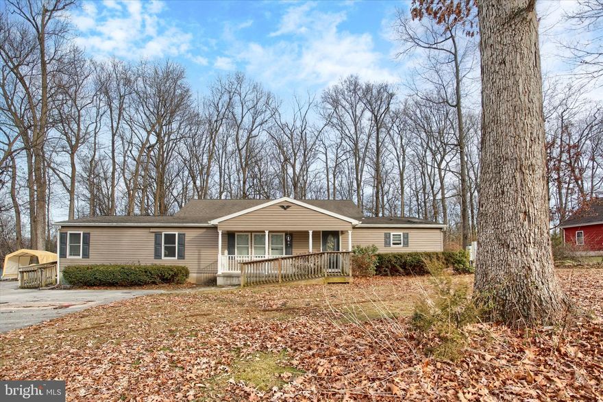 Spacious single family home on an acre lot. Home offers a living room, dining room, kitchen with ample cabinet space, Primary bedroom with full bath, soaking tub and double vanity.  2 additional bedrooms and full bath, plus a family room with doors leading to large deck for relaxing and entertaining or utilize this space for two more additional bedrooms!! Schedule your private showing today!