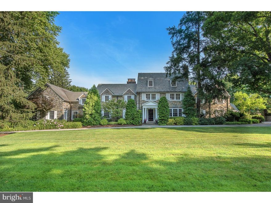 Here's your opportunity to live on the Main Line's most beautiful street. The expansive two plus acres totally private and all useable is unmatched .  A wide circular driveway leads you to this majestic, all-stone  timeless home.  The first floor has a gorgeous New Kitchen recently enlarged with white custom cabinetry and striking marble counters.  The kitchen has an oversized center island  with seating and under-counter cabinetry. There are two sinks and dishwashers as well as a separate butler pantry with loads of extra cabinetry and counters to accommodate small appliances.  The kitchen opens to  the breakfast room and family room.  The views from the kitchen, breakfast, and family room are filled with light, offering a striking view of the property  that includes the swimming pool and entry to the slate patio.  The breakfast and family rooms have high ceiling  and  a fireplace in the family  room.  The large center hall opens to a step-down living room with a high ceiling and fireplace offering symmetry to the room.  The generous dining room has a third  fireplace and double  French Door  entry from the center hall.  The paneled study has a forth fireplace with an exit to the rear grounds.  Two powder rooms are conveniently located on the first floor.  Finally, there is a first-floor addition   a bonus room   whose use is limited only by your imagination.  The addition ...stone and slate exterior was meticulously constructed to match the original structure.  The addition has a large open room with a soaring ceiling. There is direct access to the pool and grounds from the addition. On the second floor you'll find  the Master Suite with New  his-and-her separate baths and separate dressing rooms.   The New baths  offer tasteful  marble finishes for today's discriminating buyer. Also, there is an en-suite bedroom along with third and fourth bedrooms and hall bath.  A separate staircase leads to an au pair suite  or guess quarters with a mini kitchen. The laundry room is on the second floor.  The  third floor has  two  large bedrooms and a full bath. The exterior is everything you'd want...beautifully landscaped and plush grounds is the backdrop of  a magnificent structure.  There is a breathtaking pool with jacuzzi waterfall with Egyptian marble decking and tile that glistens like glass.  The outdoor kitchen includes granite counters and a stainless-steel full size  refrigerator, ice maker,  gorgeous cabinetry and large stainless sink. There is a stainless built-in barbecue grille and storage drawers. The kitchen is inclosed by attractive sliding glass doors.   For relaxing by the pool enjoy the outdoor gas fire pit  next  to the pool and kitchen.Also featured is a dressing room with cubbies, a full bath, a private outdoor shower, and large storage room for outdoor furniture.  The pool equipment is hidden by a stone wall built to match the home. The four-car garage is walled off by a timeless elegant stone wall that provides complete privacy. If you are looking for a classic, elegant Main Line residence on the area s most desirable street, you have  found your dream. ***This home has just undergone renovations offering a New Custom Kitchen and Master Baths....His and Hers!