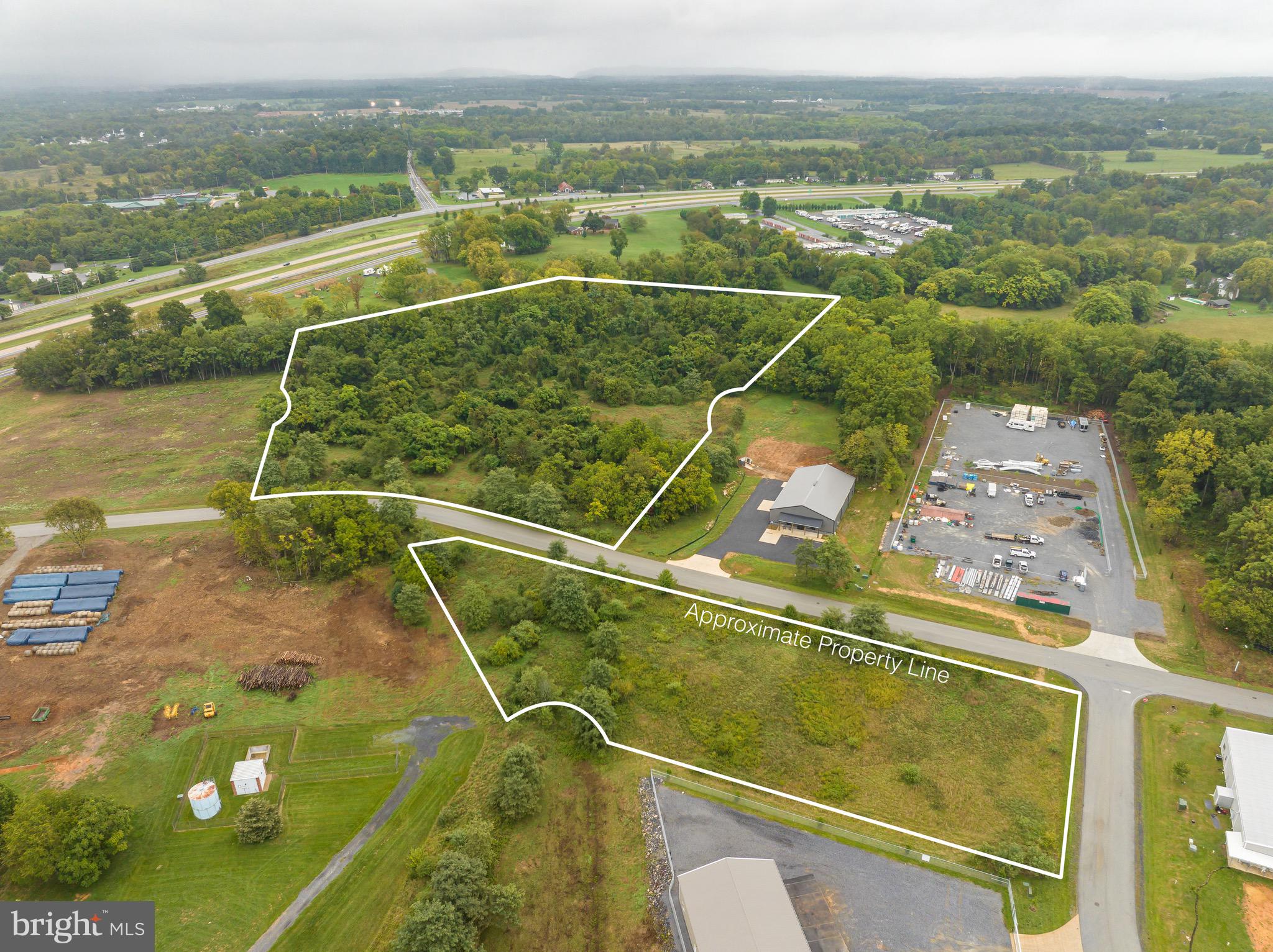 BACK ON THE MARKET WITH A GREAT PRICE IMPROVEMENT!
Prime industrial/commercial Lot with exceptional road access in Kearneysville, WV.
This expansive lot features excellent road access, with a direct connection to the fast-growing Burr Business Park. Positioned in a high-traffic area, this prime location ensures maximum visibility and accessibility for potential businesses.
Take advantage of the 12.14 acres, offering ample space for construction, expansion, and landscaping to suit your business needs.
Invest in the future of your business by securing this exceptional industrial/commercial lot in Kearneysville, WV. Seize the opportunity to establish a thriving business parcel in a location designed for success. Contact us today to arrange a viewing and take the first step toward realizing your entrepreneurial vision!