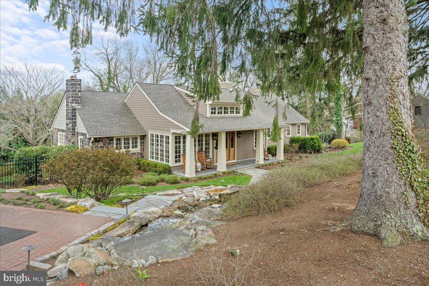 EXCEPTIONAL DOYLESTOWN BOROUGH HOME, this one of a kind, pristine home will exceed your expectations, expansive and well appointed. Completely renovated 5 bedroom, 3.5 bath home with approximately 5,000 sqft of living space is situated on a magnificent private lot with extensive landscaping and hardscaping. Enter the property by following the lovely bluestone walkway flanked by a cascading waterfall/pond and you will reach the Craftsman style front porch with a blue stone patio. The captivating foyer is surrounded by windows and features exposed stone walls, raised ceiling with beams, 2 walk in closets with custom built in shelving and cabinetry.  The luxurious primary suite features exquisite architectural details, a new gas fireplace accented by custom built-in cabinetry and exposed stone wall, window seat, two walk-in closets with built in shelving and drawers. The spa-like primary bath is a wonderful mix of natural materials; double sinks with marble countertop, walk in shower with dual shower heads. The upper level also includes three good sized bedrooms, a full bath and a sizable laundry room. The third floor is a charming space for a 5th bedroom or an office. The extraordinary main level of this home will take your breath away! The living room includes a lovely stone fireplace, built-in cabinets, and window seat. Next you enter the magnificent kitchen highlighting a new Bertazzino oven with gas cooktop, range hood with Mercer tiles, island with wood counter top, 2 walk-in pantries and just off the kitchen is the wine cellar.  The custom wine cellar has the capacity for approximately 500 bottles of wine. The kitchen opens to the incredible Great Room which features exposed stone walls, wall of windows, a massive stone fireplace with raised stone hearth and wood storage, high ceilings with skylights and a dining area with custom built-ins with double Sub-Zero beverage refrigerators, sink and ice maker. The spectacular porch will be one of your favorite spots featuring cedar beams and framing, PA bluestone floor, wood burning fireplace, outdoor kitchen with gas grill. The main floor also includes a gorgeous, newly renovated full bath, built-in desk/homework area for 2. Finished lower level. Fantastic new gym/workout room situated above the oversized garage. The extensive bluestone patio areas offer endless possibilities for relaxing and entertaining; sitting areas, dining, fire pit, an additional terraced patio all surrounded by flawless landscaping.  The best of Doylestown borough living…. A truly beautiful home, impressive large property with privacy and an easy walk to shops, restaurants and museums. A very special home that you must see to appreciate!
Please enjoy the video!