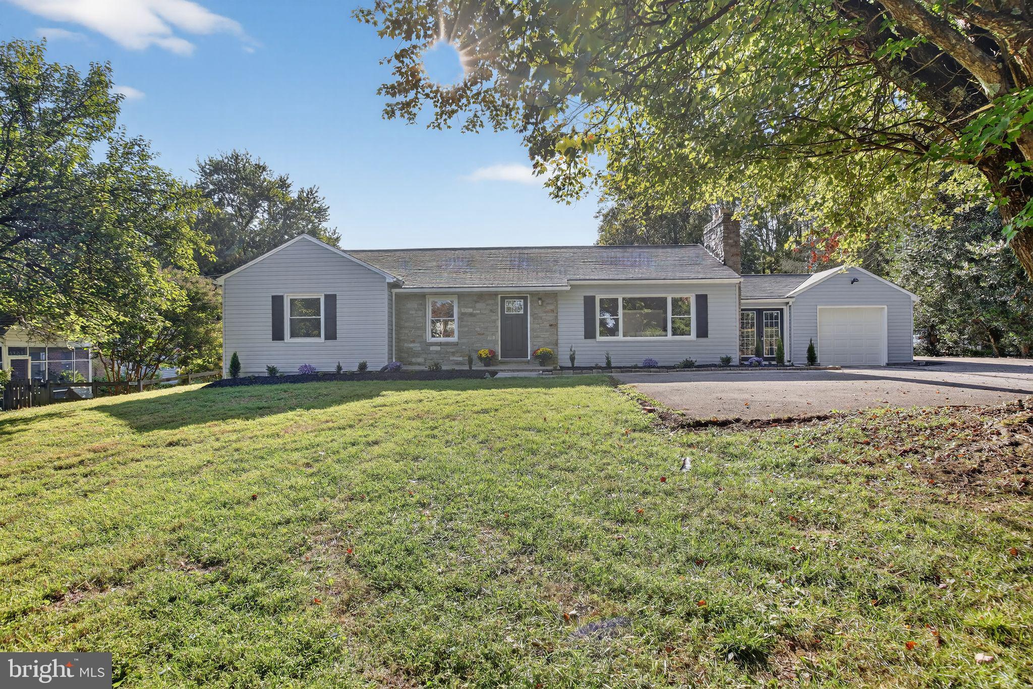 Almost an acre of treed, level & private lot surrounds the 4 bedrooms, 2.5 baths with a large addition overlooking the backyard & covered patio. Offering a renovated kitchen with new cabinetry, appliances, backsplash & Quartz counters ready for your chef's creations! All new LVP flooring and fresh paint throughout. New renovated bathrooms with up to date designer tiles & finishes. Generously sized bedrooms, 3 with ceiling fans and a new primary suite with a large picture window. The living room is graced with a stately stone fireplace that is the same stone accenting the exterior. Family room opens to the patio. Finished rec room, half bath and laundry room with steps up to the backyard on the lower level. Oversized one car garage attached to a very large mudroom/breezeway. New HVAC, 4 year old roof, many new windows, new garage door , landscaping & new French drain. Enjoy one level living with a large yard & NO HOA. Lots of parking with room for a basketball hoop! Convenient location close to major thoroughfares, shopping & restaurants.