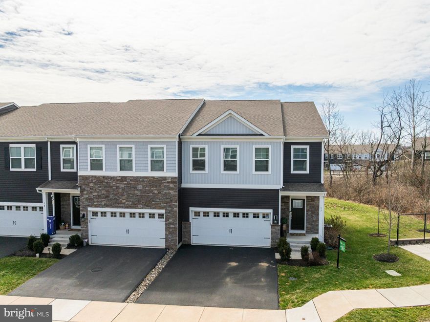 Stunning End-Unit Townhome with Open Floor Plan, 4 Bedrooms & Scenic Views in a Private 49-Home Community.  Welcome to this beautifully maintained 2-story end-unit townhome located in a charming community overlooking peaceful open space—offering the perfect combination of privacy, convenience, and modern living.  Step inside to a bright, airy open-concept floor plan with a clean, neutral palette and gorgeous flooring throughout. The spacious living room flows seamlessly into the dining area and designer kitchen, making this home ideal for entertaining and everyday living. The chef’s kitchen is truly the heart of the home, featuring:  A large 8x4 island with sink—perfect for gathering and meal prep, Quartz countertops & stylish tile backsplash, 5-burner gas range, Recessed lighting, large walk-in pantry, and sliding doors leading to the rear deck for outdoor enjoyment. The main level also boasts 9-foot ceilings, a convenient powder room, and direct access to the attached 2-car garage. The 2nd level brings you to 4 spacious bedrooms, including a luxurious primary suite designed for comfort and relaxation. The suite features a walk-in shower, double sinks, tile flooring, subway tile surround, and linen closet. Three additional generously sized bedrooms—one with a walk-in closet—share a well-appointed hall bath with double sinks, and the full laundry room on this level adds ultimate convenience. The partially finished lower level provides flexible living space with recessed lighting, along with a utility room and additional storage.  Additional Highlights Include efficient gas heating & central air, sprinkler system, 200-amp electrical service and all systems and construction 5 years young. Ideally located just minutes from Route 422, the PA Turnpike, I-76, and Route 202, offering easy access for commuters—yet tucked away in a peaceful, private setting. This move-in ready home combines modern design, functional space, and a prime location—a rare opportunity in today’s market.