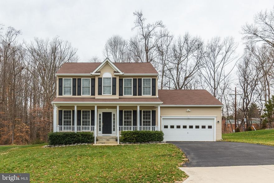 Beautiful Light Filled Colonial On 1/2 Acre Lot in A Wooded Park Like Setting! The Maintenance Free Front Porch Is So Welcoming! Spacious Family Room with Gas Fireplace. Formal Dining Room with Hardwood Floors, Chair Rail and Crown Molding. Main Level Office. Eat-In Kitchen with Newer Appliances. Freshly Painted and New Carpet Throughout. Master Bedroom with Attached Luxury Bath with Soaking Tub, Separate Shower and Dual Sinks.  Wonderful Walk-In Closet with Wood Shelving! Large Secondary Bedrooms. Design Your Unfinished Basement How You Wish.  Walkout to Yard. Bedroom Level Laundry with an additional hookup in Main Level Mudroom. Sit on Lovely Stamped Concrete Patio, Relax and Listen to The Birds or Other Wild Life! 2 Zone TRANE HVAC. Minutes To 95, Rt1, VRE And Downtown Fredericksburg. Check out attached documents for additional features and upgrades! You will not be disappointed.