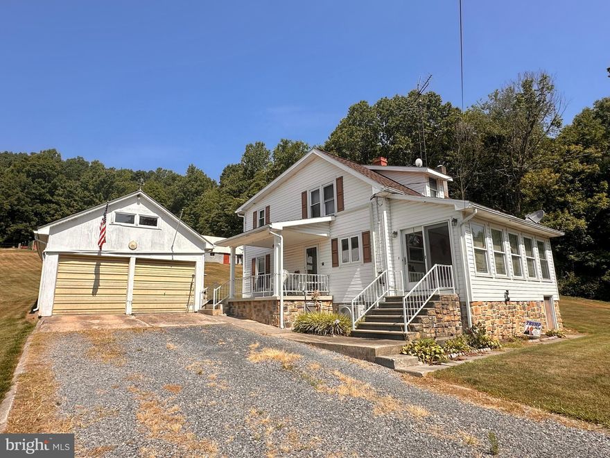 Well-maintained farmette in the country.  Bring the kids and animals! You will love this 8.3 acre property that abuts to Buchanan State Forest (Sideling Hill) and only minutes to SGL #121 for recreational enjoyment. New, 4-strand, high tensile fence with a large, run-in shed and stable/2-story barn. Detached 2-car garage. If you want some room to roam with privacy, this may be the one.