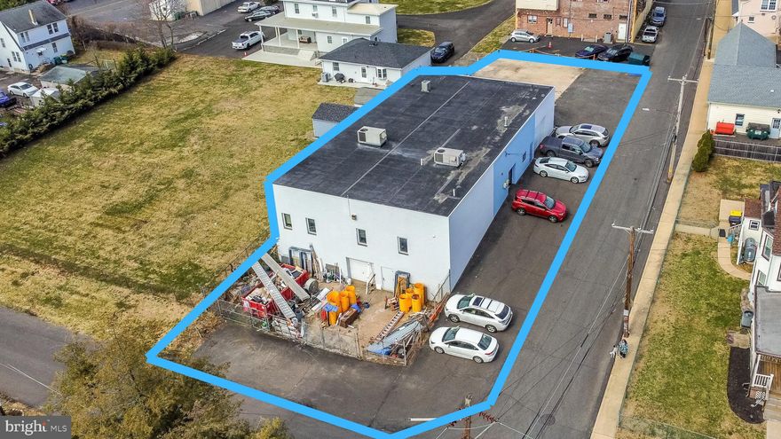 946 Simons Ave | Bensalem, PA 19020
Rare opportunity to acquire a highly functional commercial headquarters property ideally suited for contractors, construction firms, service companies, or owner-users seeking a turnkey operations hub in a prime Bucks County location.
Currently operating as the headquarters for a successful construction company, this well-maintained property offers an exceptional combination of professional office space, warehouse capability, secured yard storage, and future expansion potential designed to support the daily operations of a growing business.
The office portion of the building features a welcoming reception area, multiple private offices, administrative workspace, and a large conference room, creating a professional environment for employees, management, and client meetings. The building also includes a full kitchen/break area along with separate men’s and women’s restrooms, providing comfort and convenience for staff and visitors.
Toward the operational side of the building is a warehouse/storage area with overhead door access, ideal for equipment storage, materials staging, and daily logistics. The portion of the building facing Simons Avenue features increased ceiling height to the roof structure, allowing the space to function as high-bay storage or warehouse space, with the flexibility to convert portions back to additional warehouse or office space depending on operational needs.
In addition to the primary warehouse area, the property offers a second secured storage/workshop area currently configured as a workshop, featuring lower-level overhead garage door access and a separate man door entrance from the secured outdoor yard, providing excellent functionality for equipment, fabrication work, or additional storage operations.
The exterior provides substantial paved parking and maneuvering space for vehicles and company fleets, along with two separate secured outdoor storage areas currently used for equipment and materials. These exterior sections also offer valuable future expansion opportunities, allowing the building footprint to potentially be extended as business needs grow.
The property is further enhanced with a fire alarm system and separate security systems, adding an additional layer of safety and operational control.
Strategically located in Bensalem Township, the property offers excellent accessibility with quick connections to Route 1, I-95, and the Pennsylvania Turnpike, allowing businesses to efficiently service Bucks County, Philadelphia, and surrounding regional markets.
Properties offering this combination of office space, warehouse capability, secured yard storage, and expansion potential rarely come to market, making 946 Simons Avenue an outstanding opportunity for an owner-user to establish or expand their company headquarters.