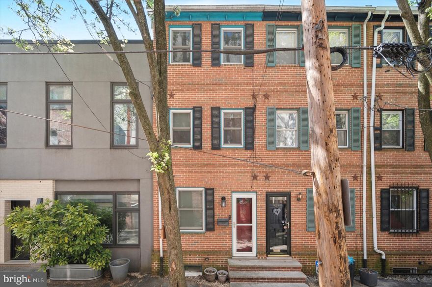 Tucked away on one of Bella Vista’s most charming blocks, 826 Kater Street blends character, thoughtful updates and an unbeatable location. This 2 bedroom, 1.5 bath home spans three stories of inviting living space with hardwood floors throughout. The main level welcomes you with a warm and open living area that flows seamlessly to a private rear patio. The lower level hosts a bright eat-in kitchen outfitted with white cabinetry, granite countertops, a stylish tile backsplash, and stainless steel appliances, along with a convenient powder room and laundry. Upstairs, you’ll find two sunlit bedrooms with ample closet space. The top floor primary bedroom boasts direct access to a private deck, perfect for your morning coffee. Other highlights include central air, recessed lighting, and a tree lined block. Just steps from South Street, Whole Foods, neighborhood parks, and SEPTA transit, this home offers a perfect blend of privacy and city convenience. Schedule your tour today!