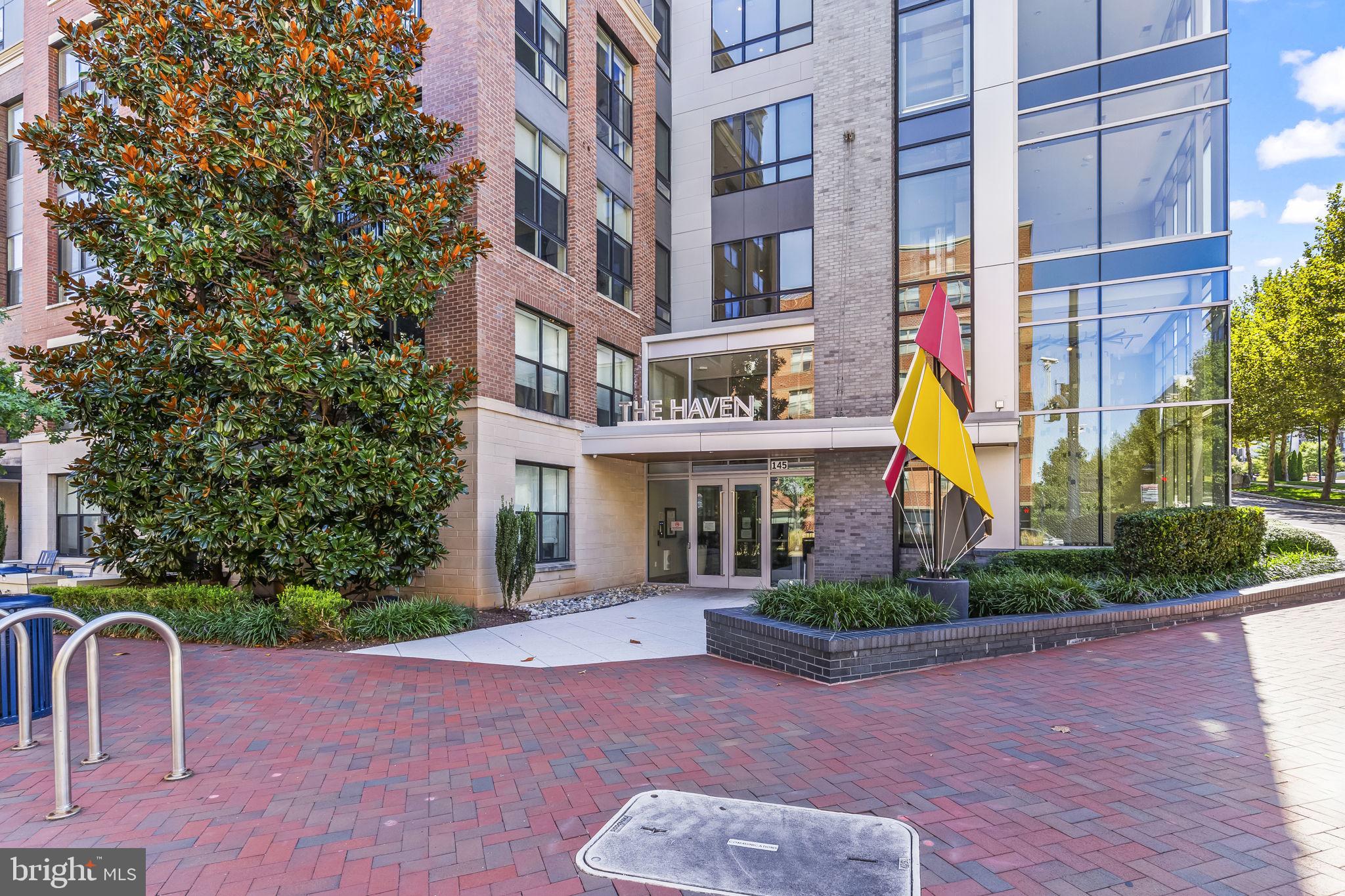Welcome to this stunning 1-bedroom, 1-bath condo in the highly desirable Haven at National Harbor. Thoughtfully upgraded, this home offers hardwood floors throughout, a gourmet kitchen with Italian-inspired cabinetry and quartz countertops, and a spacious owner’s suite with a custom walk-in closet featuring built-ins. The spa-like bath and in-unit washer/dryer add everyday convenience. One garage parking space (B-99) conveys. Beyond your front door, enjoy a full suite of resort-style amenities, including:
Multiple resident lounges with WiFi, workstations, TVs, and a party room with kitchenette and billiards, a fully equipped state of the art fitness center with a separate yoga studio, heated outdoor pool with sundeck, pet spa with grooming facilities for your furry friends, climate-controlled bike storage, and Amazon package lockers. Convenient Keyless fob entry, Kastle App remote access, routine HVAC maintenance, in a secure building with friendly concierge service. The Haven is a LEED-certified building just two blocks from the vibrant and exciting waterfront at National Harbor. Explore scenic walking and biking trails, shopping, dining, and nightlife at National Harbor’s vibrant venues, including the MGM Grand Hotel & Casino. All this in a fabulous location offering easy access to D.C., Northern Virginia, and Maryland.